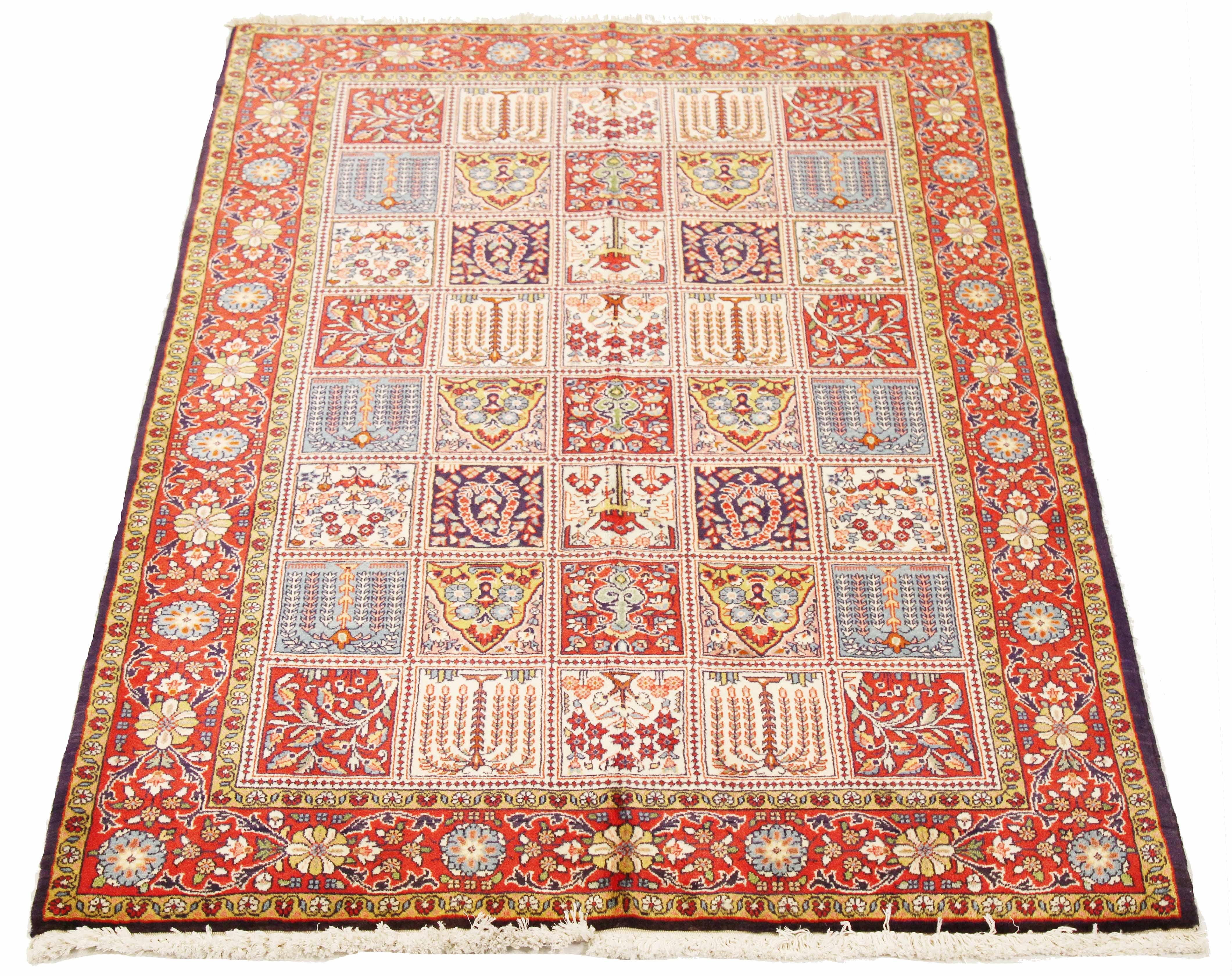 Vintage Persian rug handwoven from the finest sheep’s wool and colored with all-natural vegetable dyes that are safe for humans and pets. It’s a traditional Sarouk design featuring colored tiles with each one filled with exquisite floral and