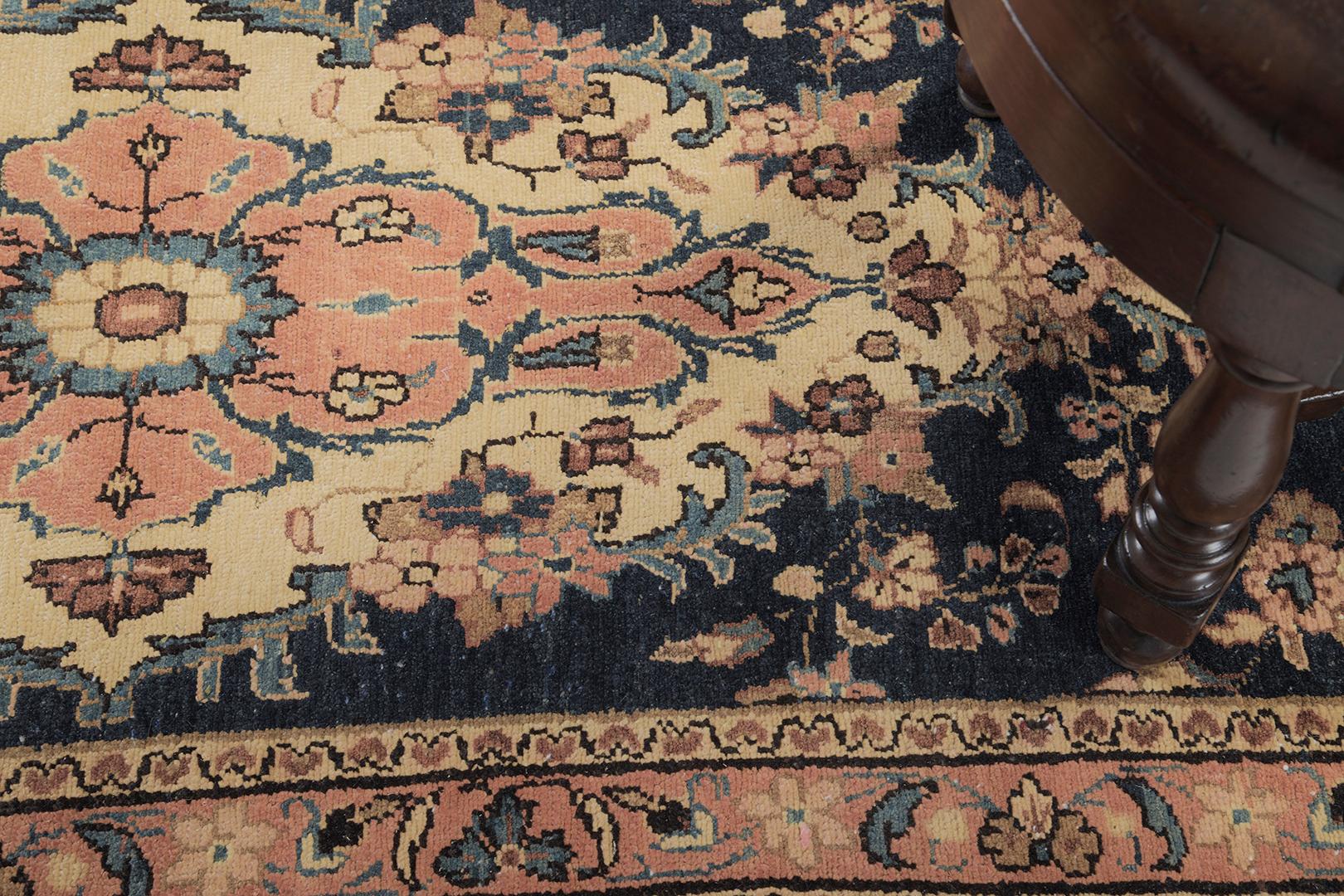 An enticing Vintage Persian Sarouk Runner that beguiles you to an all-over pattern of botanical elements that never ceases to amaze. The abrashed dark blue field is covered by majestic patterns of blooming palmettes, alluring blossoms and stylized