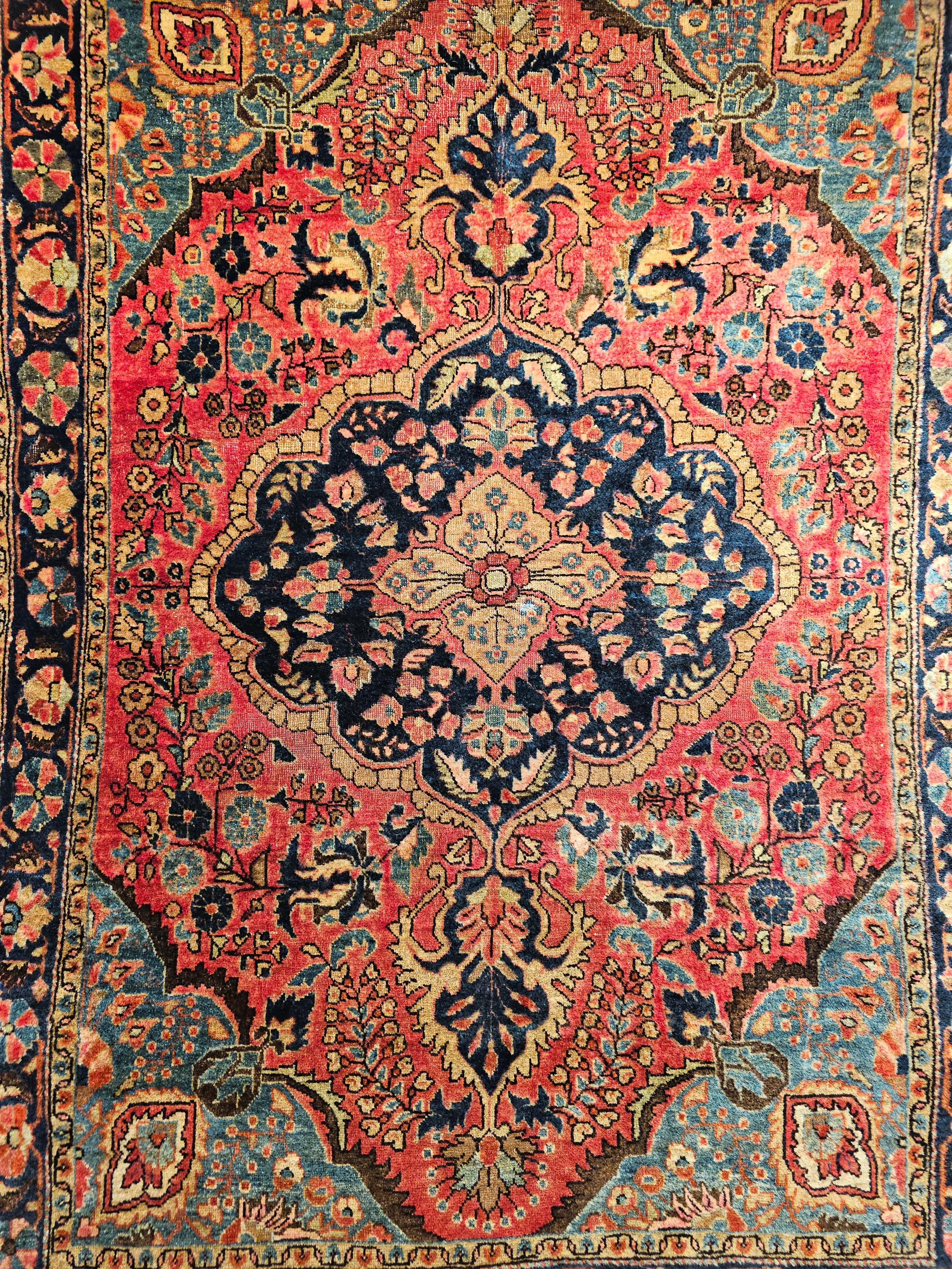 Hand-Knotted Vintage Persian Sarouk in Floral Design with Turquoise, Navy Blue, Red Colors For Sale
