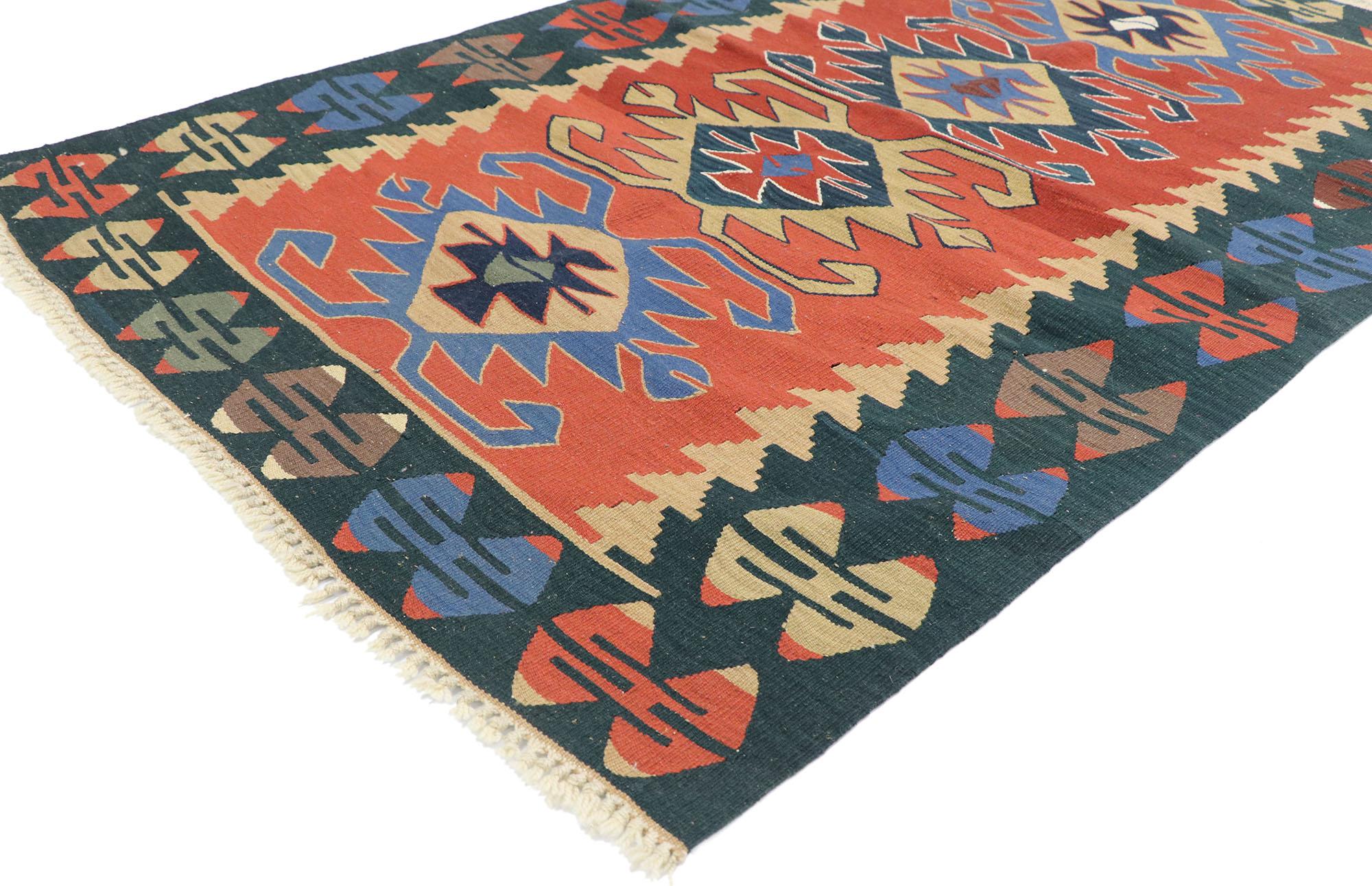 77825 vintage Persian Shiraz Kilim rug with Tribal style 03'10 x 05'09. Full of tiny details and a bold expressive design combined with vibrant colors and tribal style, this hand-woven wool vintage Persian Shiraz kilim rug is a captivating vision of