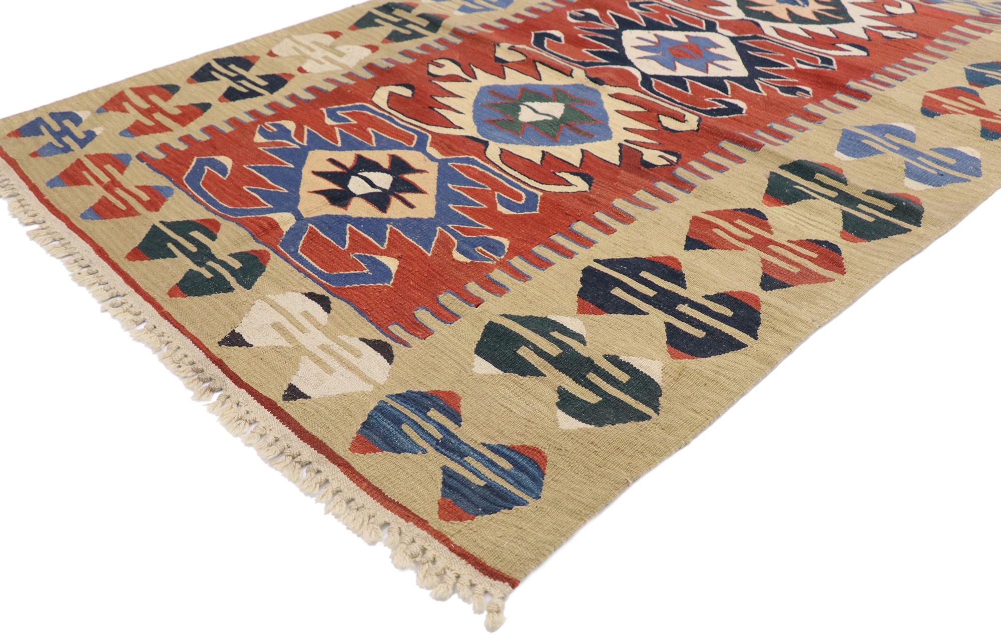 77824 vintage Persian Shiraz Kilim rug with Tribal style 03'10 x 05'04. Full of tiny details and a bold expressive design combined with vibrant colors and tribal style, this hand-woven wool vintage Persian Shiraz kilim rug is a captivating vision of