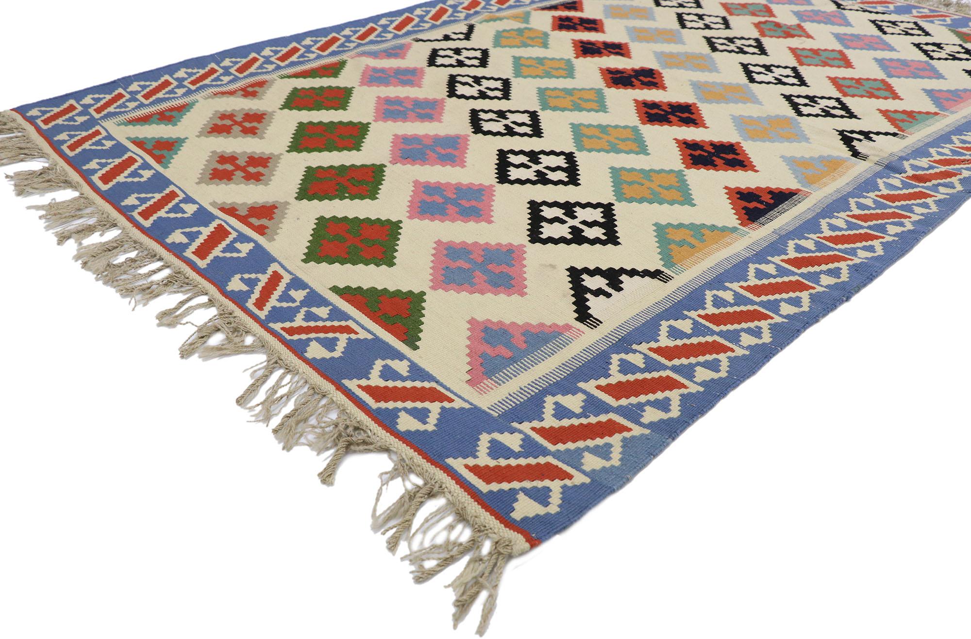78028 vintage Persian Shiraz Kilim rug with Tribal style 04'02 x 06'04. Full of tiny details and a bold expressive design combined with vibrant colors and tribal style, this hand-woven wool vintage Persian Shiraz kilim rug is a captivating vision of
