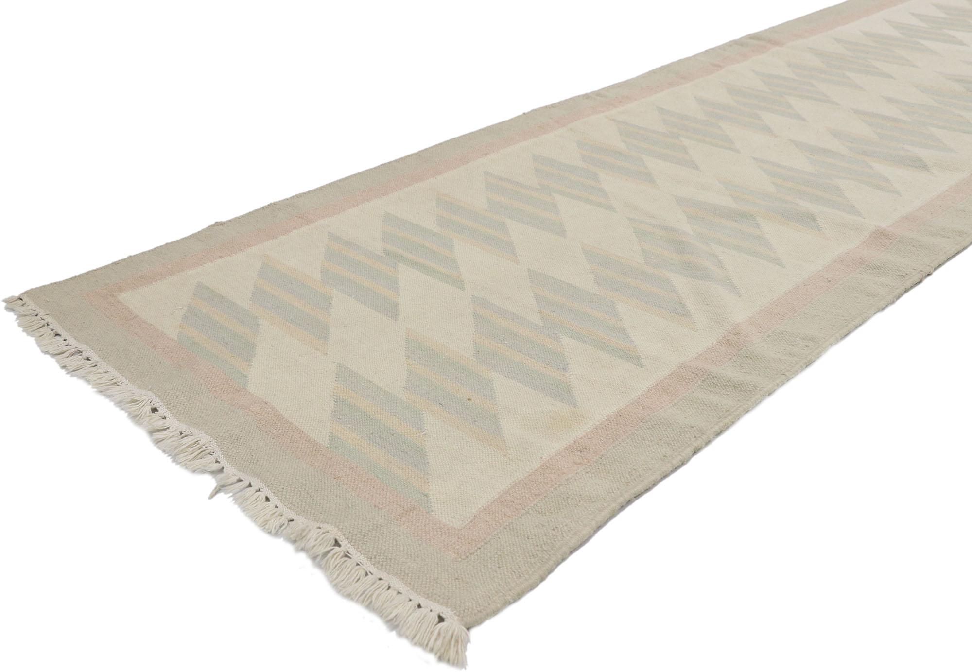 78055, vintage Persian Shiraz Kilim Runner with Southwestern Bohemian style. Full of tiny details and effortless beauty combined with subdued colors and tribal style, this hand-woven wool vintage Persian Shiraz kilim runner is a captivating vision