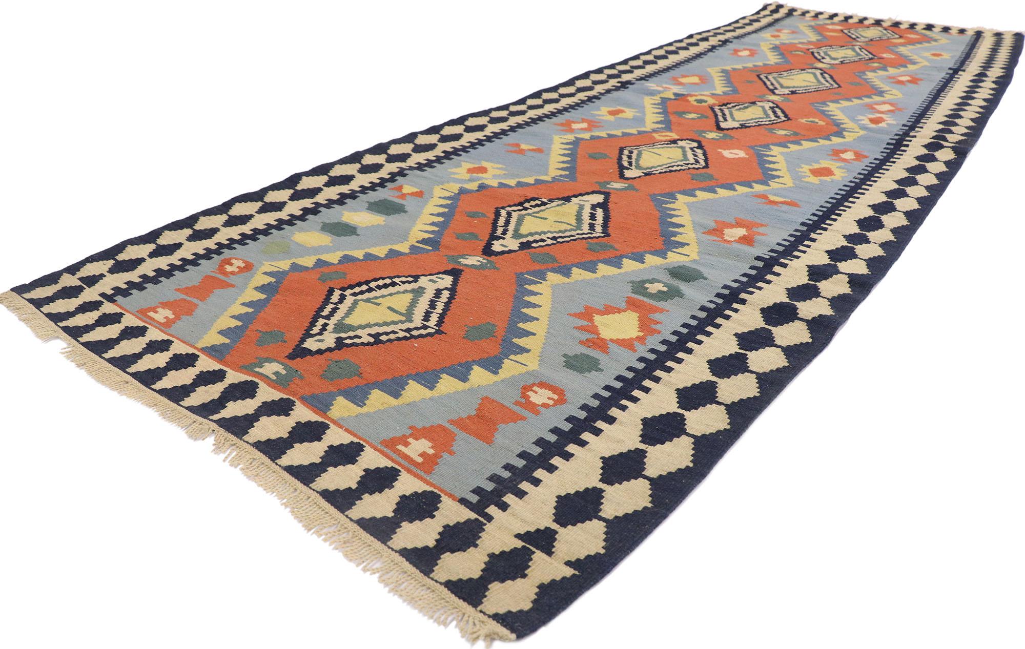 77933 Vintage Persian Shiraz Kilim runner with Tribal Style 03'06 x 10'09. Full of tiny details and a bold expressive design combined with vibrant colors and tribal style, this hand-woven wool vintage Persian Shiraz kilim runner is a captivating