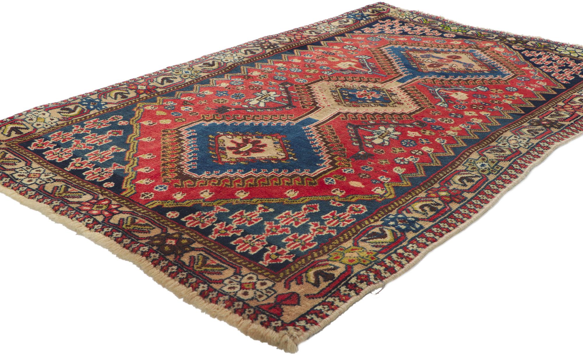 61131 Vintage Persian Shiraz Rug, 02'10 x 04'06. Full of tiny details and nomadic charm, this hand knotted wool vintage Persian Shiraz rug is a captivating vision of woven beauty. The eye-catching tribal design and lively colorway woven into this