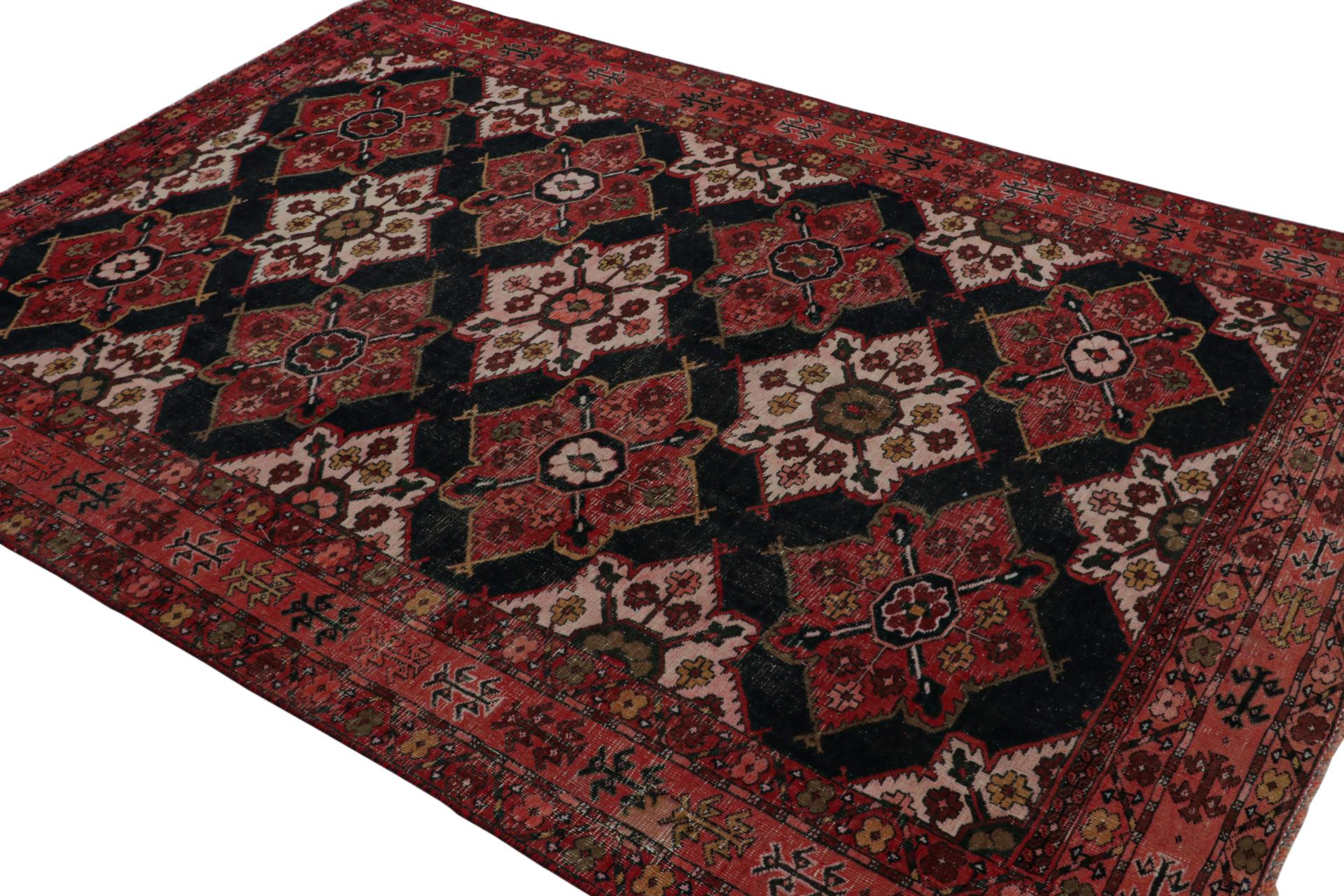 From our new collection of overdyed rugs, a vintage 6x8 Persian rug originating circa 1970-1980. Hand knotted in wool on cotton.

On the Design:

The black field underscores rich red floral patterns in medallions and borders alike. The delicious