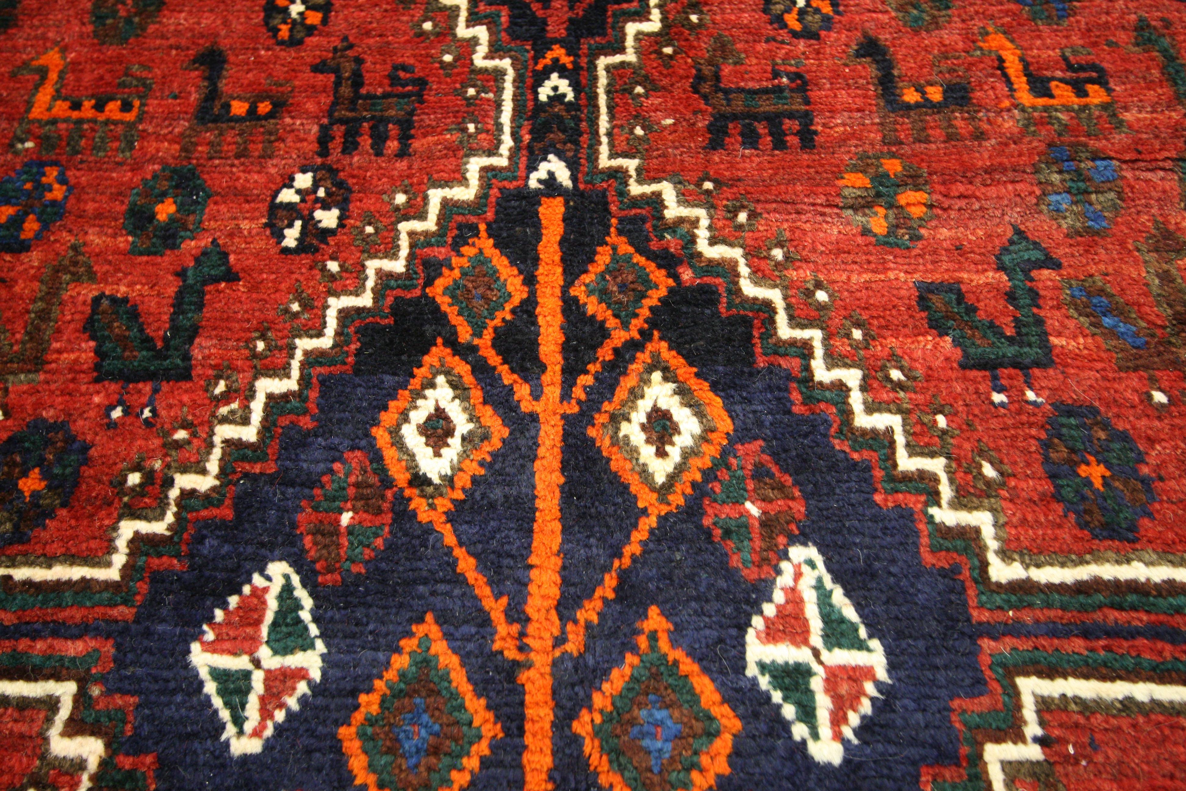 76021, vintage Persian Shiraz tribal motif rug. The combination of geometric and animal motifs makes this Persian tribal rug a statement piece for nearly any modern space. This hand-knotted wool vintage Persian Shiraz tribal rug features a three