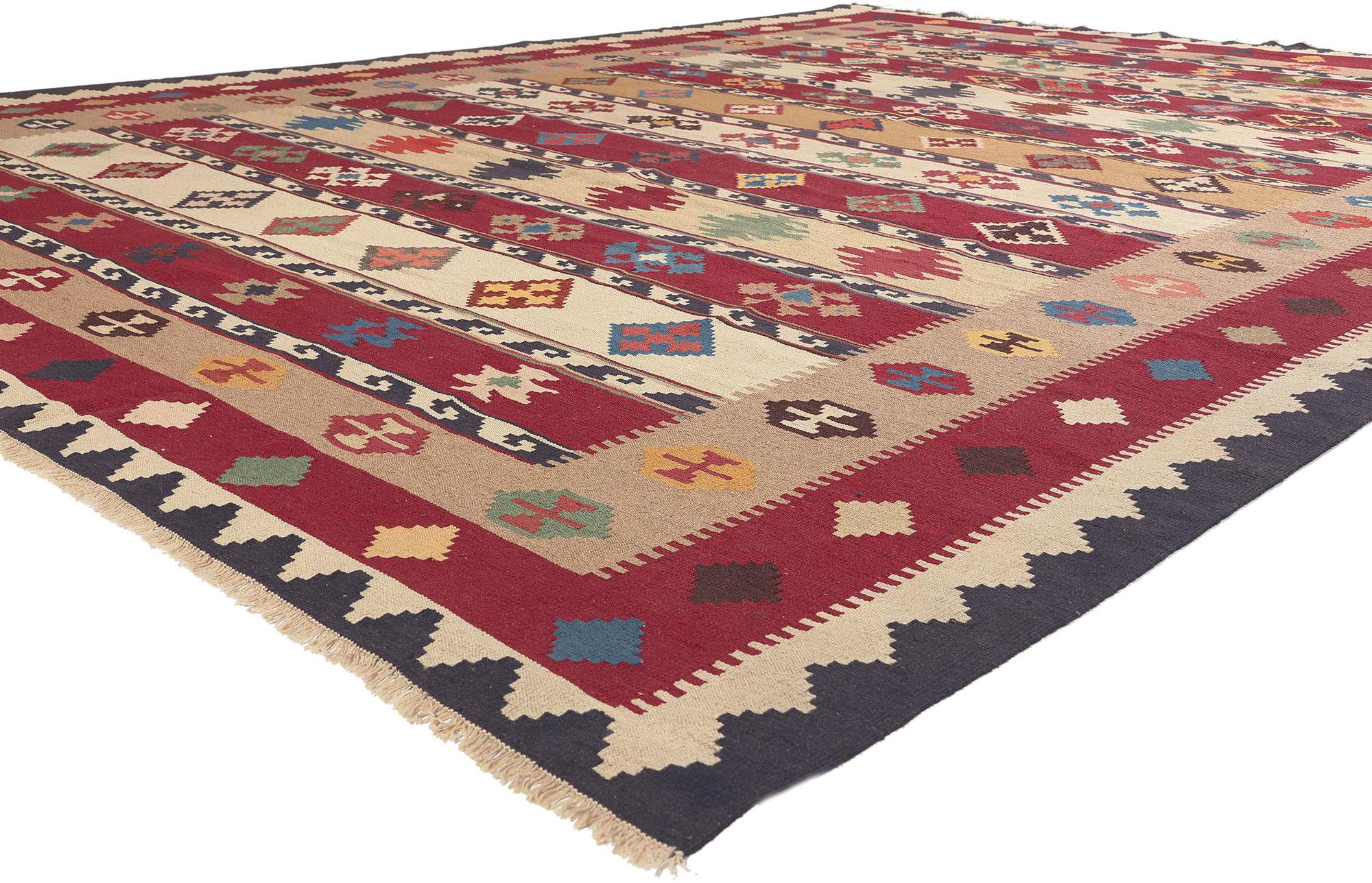 78605 Vintage Persian Shiraz Tribal Kilim Rug, 09'10 x 12'11. 
Emanating nomadic charm with incredible detail and texture, this handwoven vintage Persian Shiraz kilim rug is a captivating vision of woven beauty. The eye-catching tribal design and