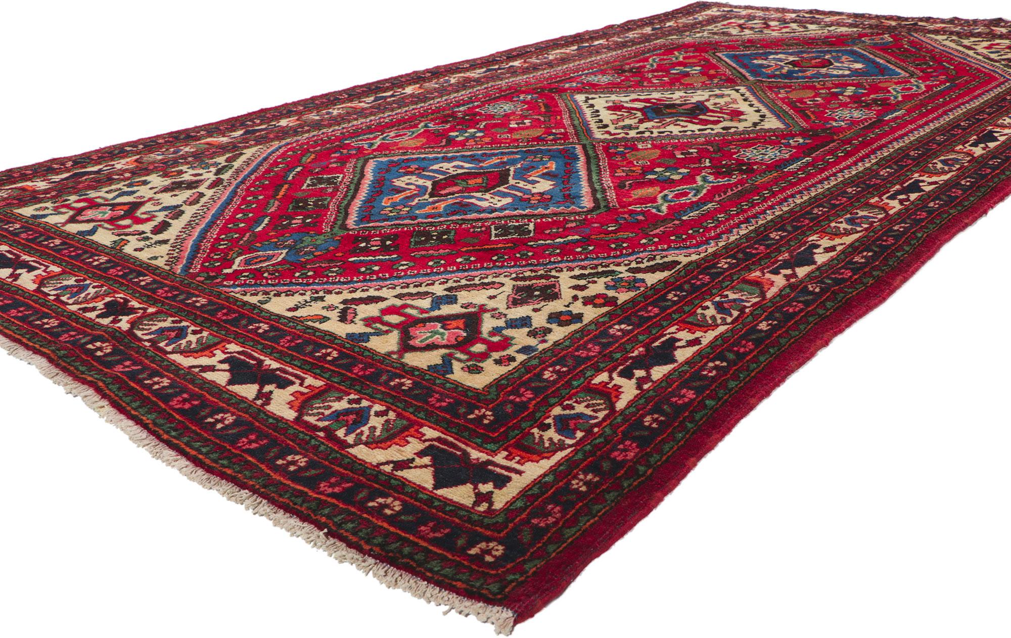 61035 Vintage Persian Shiraz Rug, 05'03 x 10'00. With its nomadic charm, incredible detail and texture, this hand knotted wool vintage Persian Shiraz rug is a captivating vision of woven beauty. The geometric design and lively colorway woven into