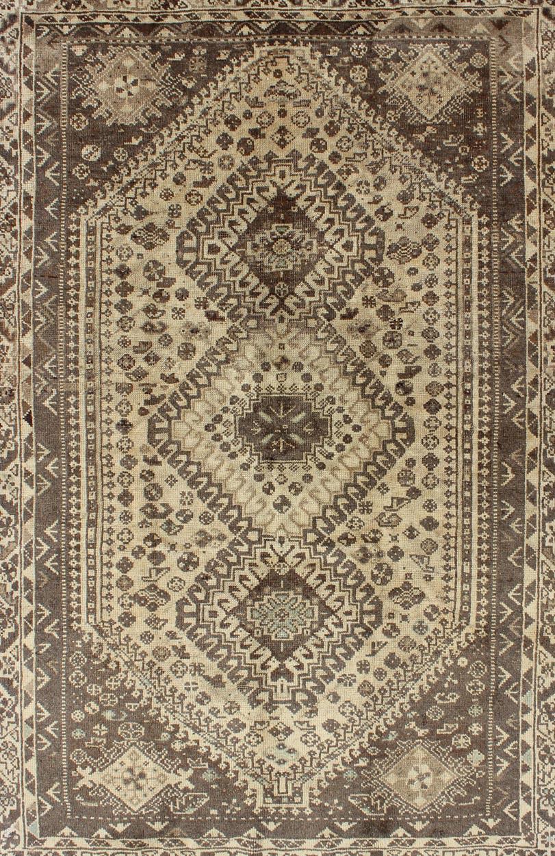 Hand-Knotted Earth Tones Vintage Persian Shiraz with Tribal Design and Neutral Colors For Sale