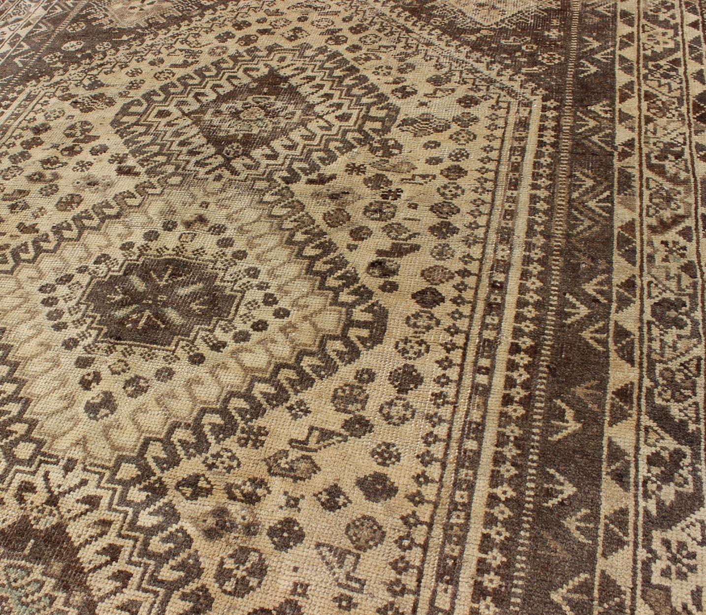 20th Century Earth Tones Vintage Persian Shiraz with Tribal Design and Neutral Colors For Sale