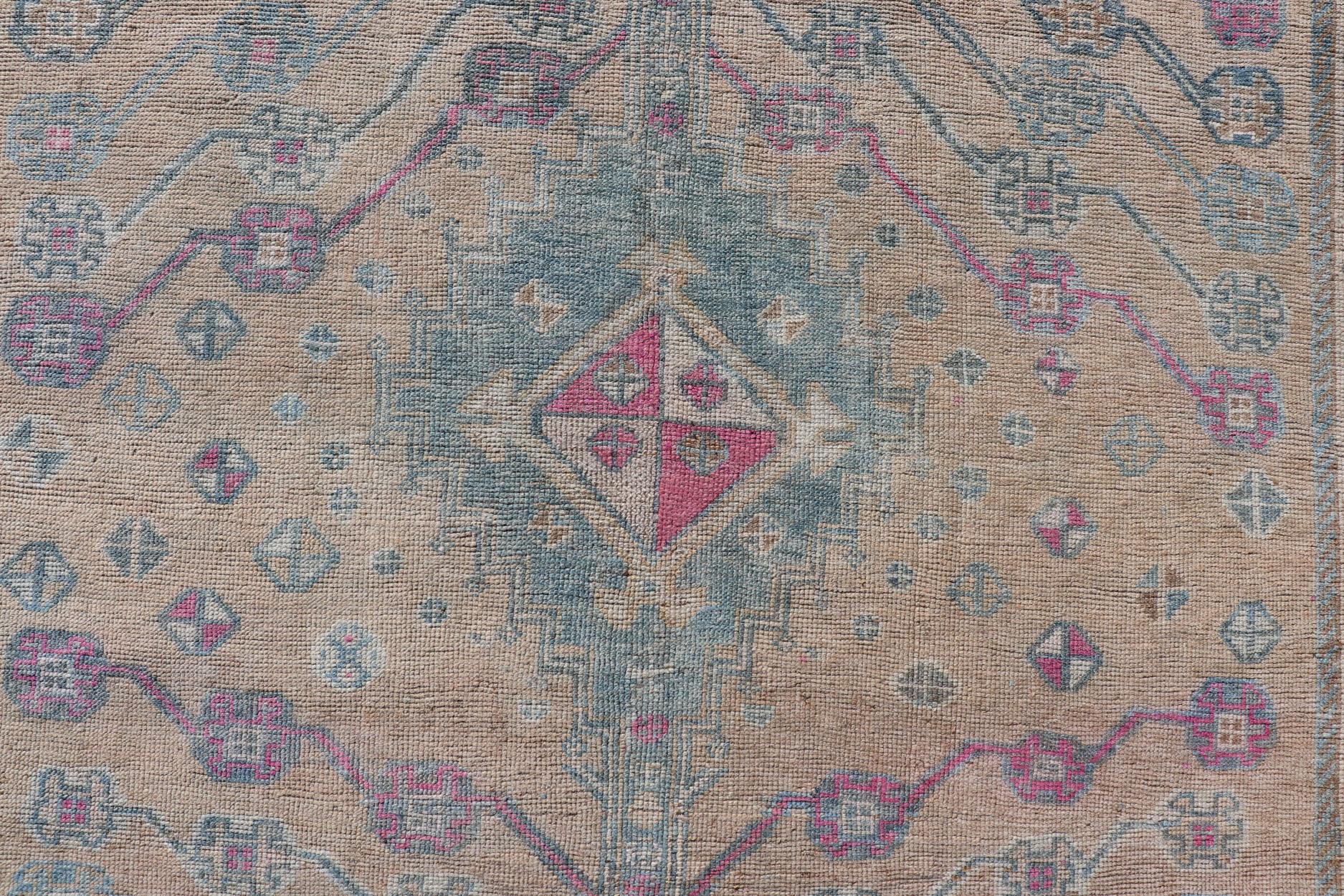 Measures: 4'10 x 7'4 
Vintage Persian Shiraz with Tribal Design in Soft Yellow, Pink, and Blue Gray. Keivan Woven Arts / rug EMB-9668-13562, country of origin / type: Persian / Tribal, circa mid-20th century. 

This vintage Persian rug features a