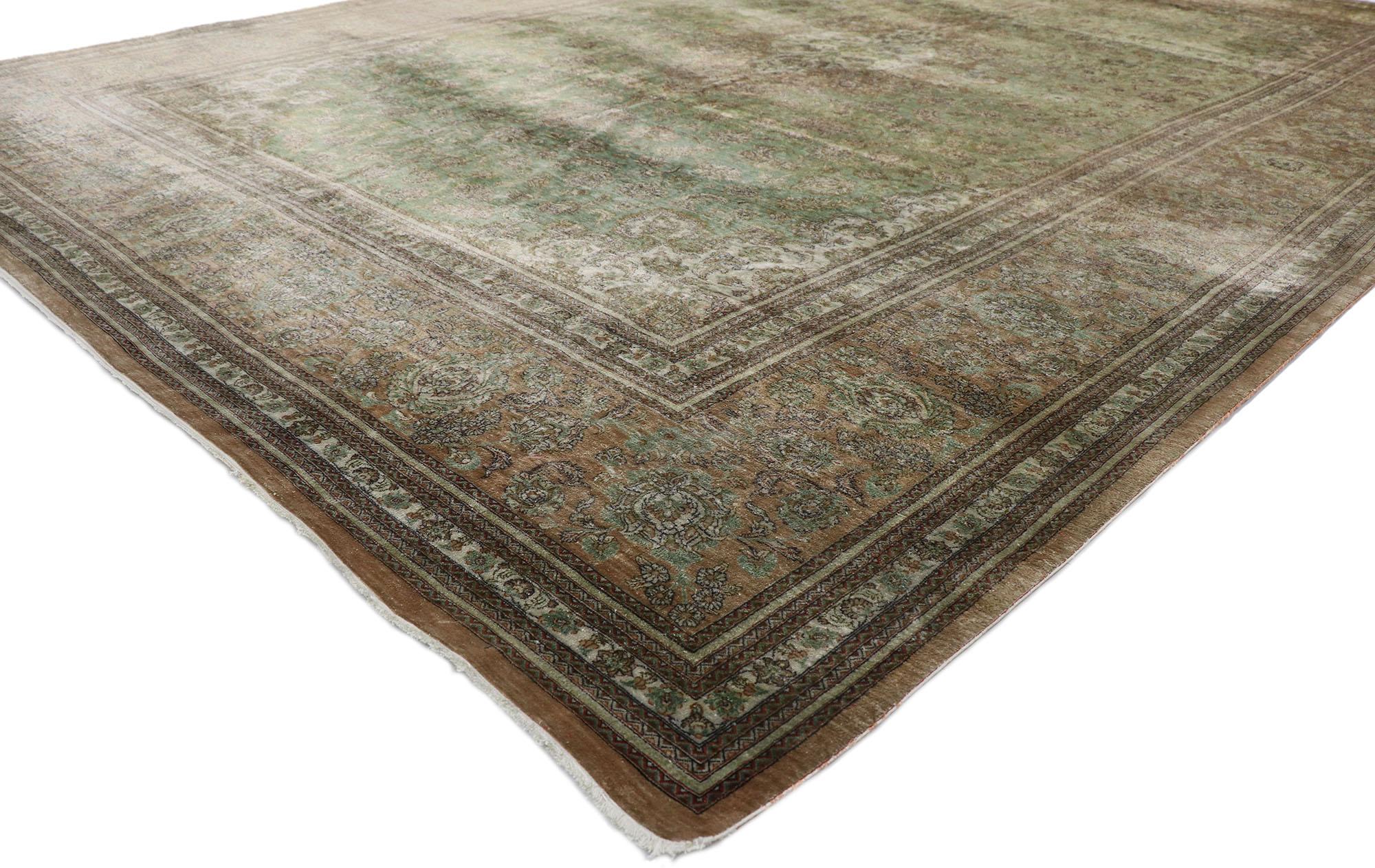 77706 Vintage Persian silk qum rug with warm Earth-tone Colors 08'00 x 11'05. Warm and inviting with incredible detail and texture, this hand-knotted silk vintage Persian Qum rug charms with ease. The silky field features an oval concentric