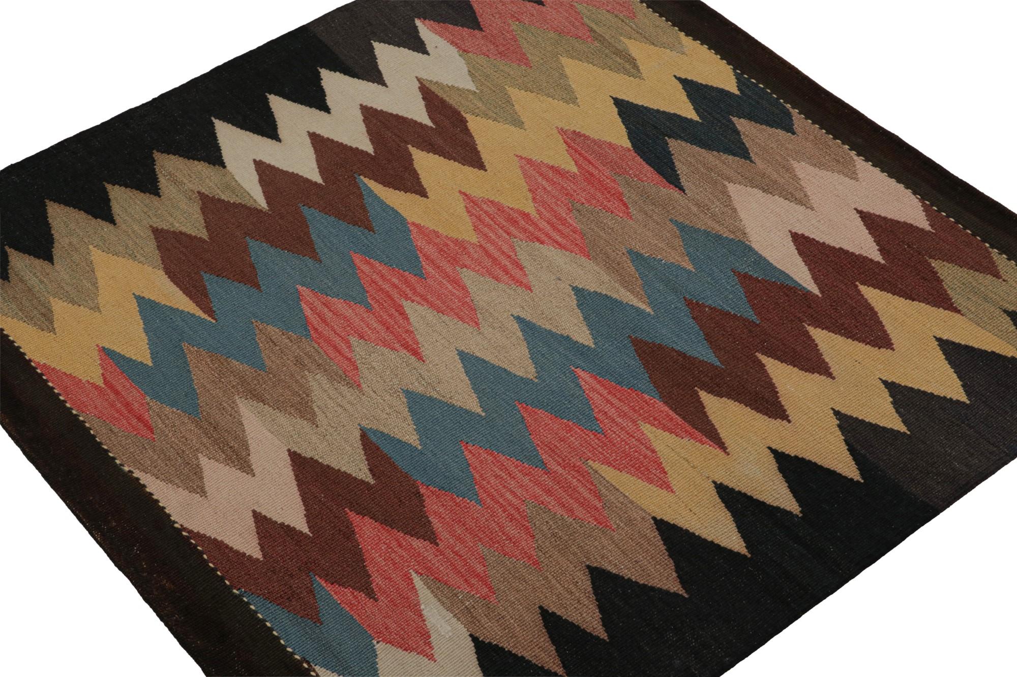 Hand-knotted in wool, this 3x3 vintage Persian Sofreh kilim and square rug originating from Afghanistan features colorful chevron patterns across the surface. 

On the design: 

Sofreh Kilims like this piece are known for their minimalist patterns