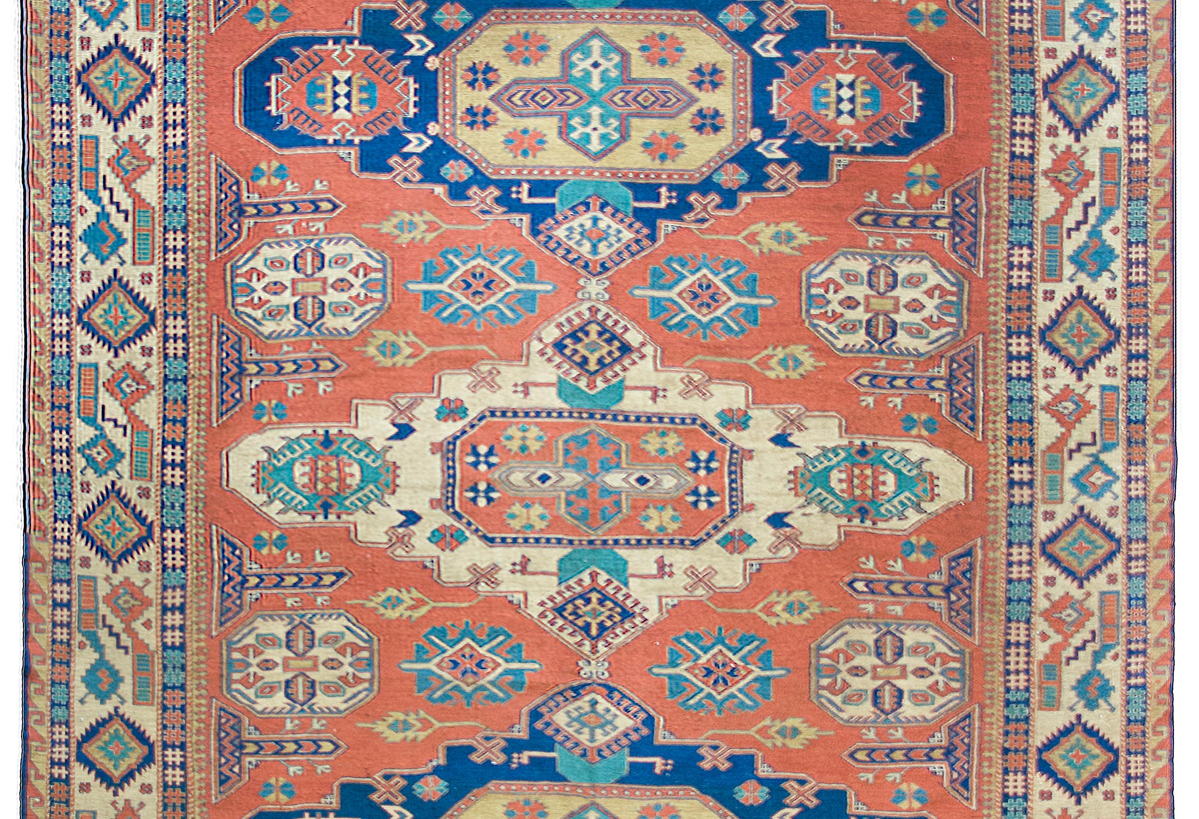 An incredible vintage mid-20th century Persian Afghani Soumak rug three large central medallions amidst a field with myriad stylized flowers and leaves, surrounded by the most incredible stylized floral medallion flanked by sets of geometric