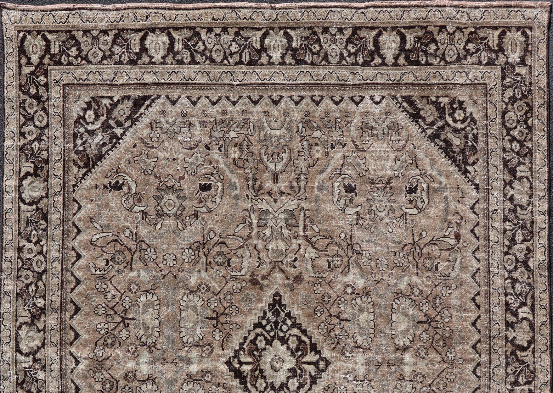 This vintage Sultanabad-Mahal rug features a sub-geometric diamond design with herati motifs. The rug is set upon a taupe background and is enclosed within a complementary multi-tiered border.

Vintage Sultanabad-Mahal Rug, rug PTA-200715, country