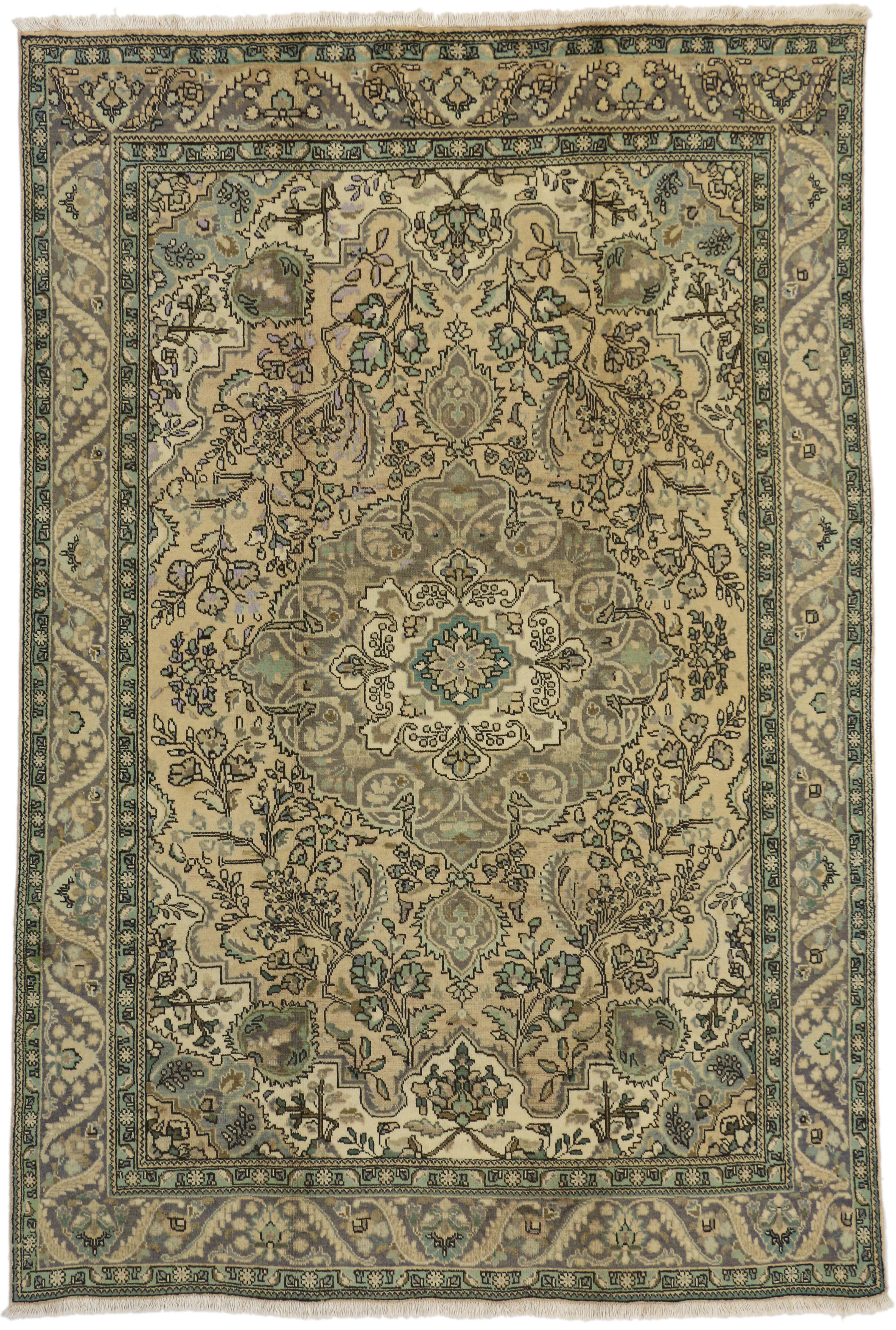 76453, Vintage Persian Tabriz Area Rug with French Provincial Style. This hand-knotted wool vintage Persian Tabriz area rug is a prime example of the skilled weavers of Tabriz. The Persian Tabriz rug is rendered in subtle, pastel hues and features a