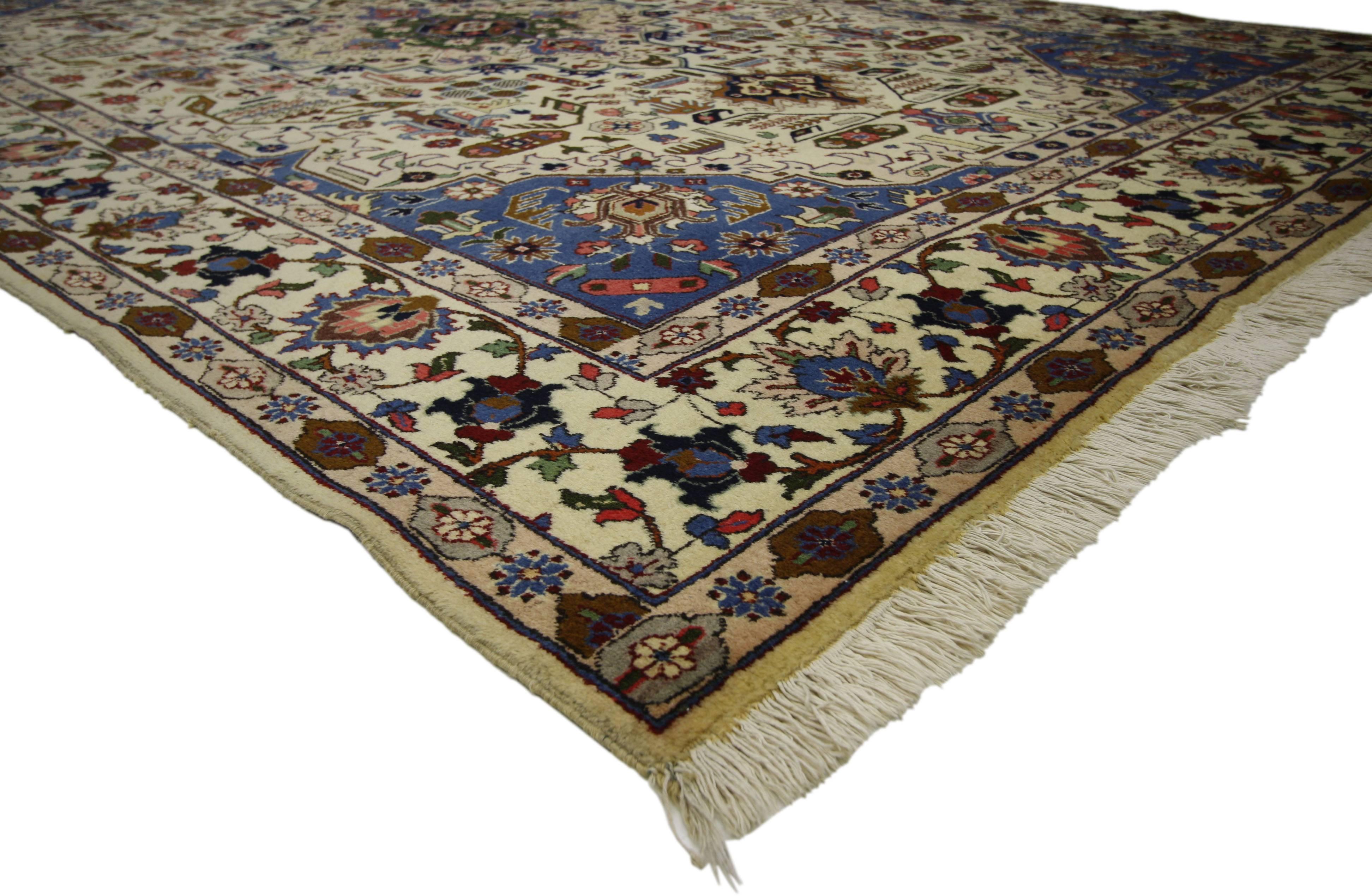 71755 vintage Persian Tabriz Area rug with modern traditional style. Vintage hand-knotted wool Persian Tabriz carpet with medallion and allover geometric floral motifs. Features a decorated ivory field framed by blue corner spandrels and floral