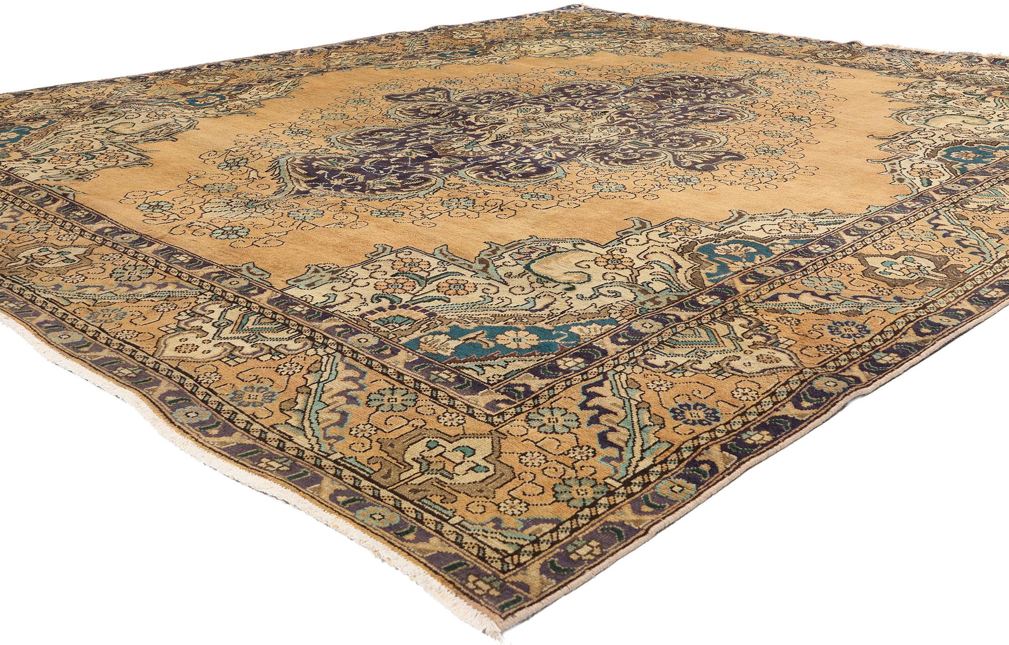 76452 Vintage Persian Tabriz Rug, 09'11 x 11'02. This hand-knotted wool vintage Persian Tabriz rug is a masterwork of traditional craftsmanship and aesthetic grandeur, exemplifying the artistry for which Tabriz weavers are renowned. Dominating the