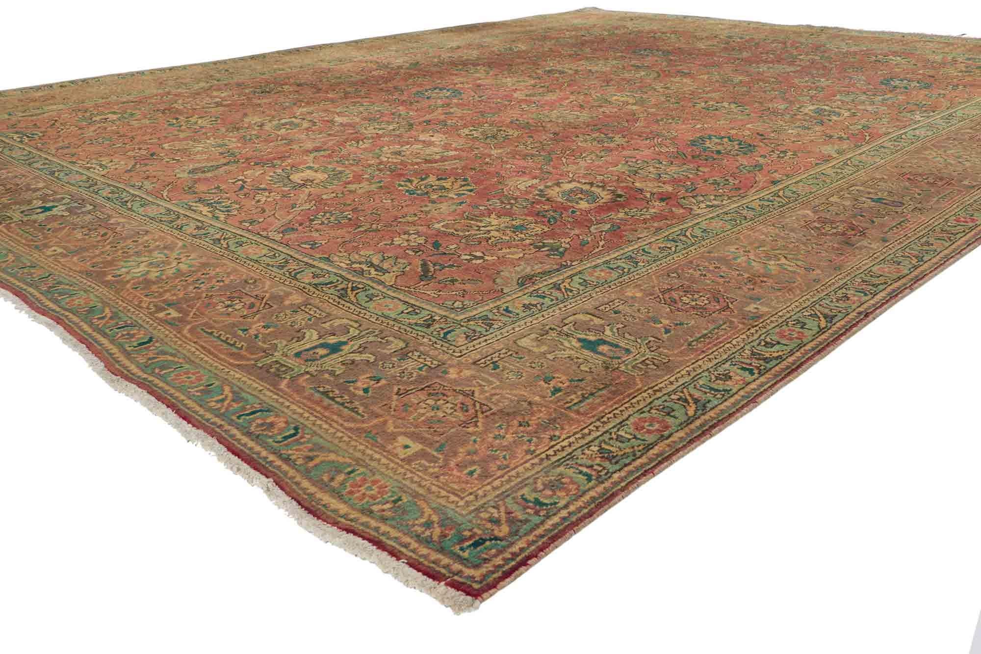 76271, vintage Persian Tabriz area rug with traditional style. This hand-knotted wool vintage Persian Tabriz rug features a an all-over botanical pattern composed of lotus, palmettes and floral vines surrounded by a Classic border creating a