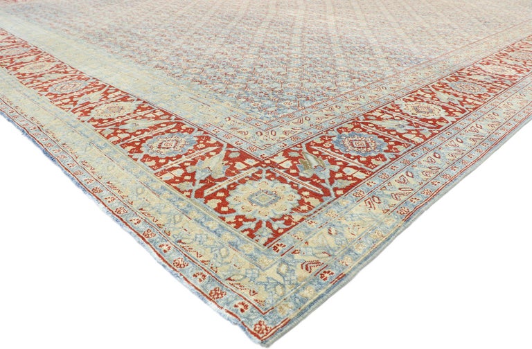 52781, vintage Persian Tabriz design rug with Southern living American Colonial style 11'02 x 15'00. With its soft, subtle hues and cozy simplicity, this hand knotted wool distressed vintage Persian Tabriz design rug charms with ease and beautifully