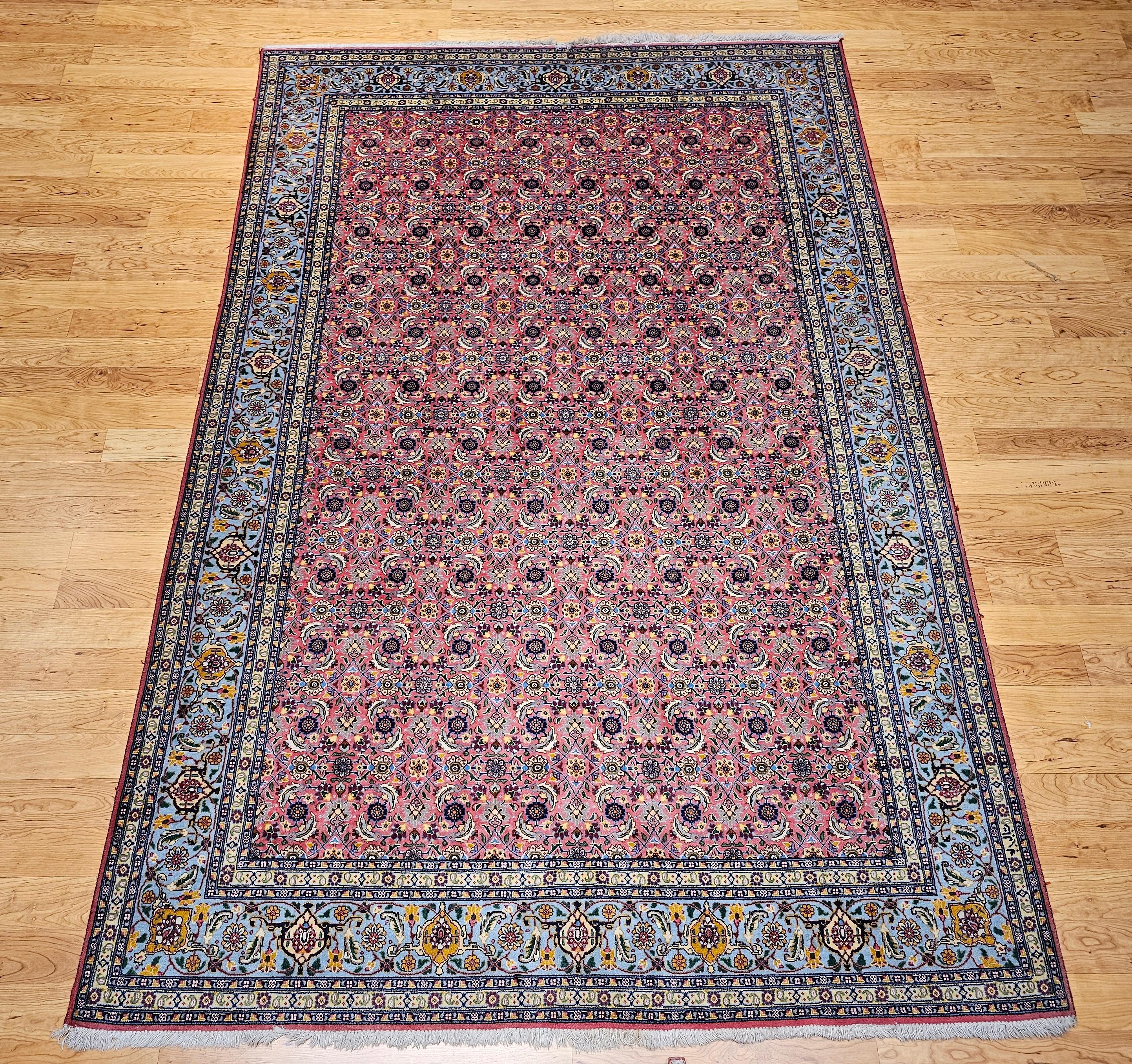 This vintage Persian Tabriz rug features a rare and highly sought-after allover Herati geometric pattern, expertly hand-knotted in Northwest Persia during the late 20th century. Designed in a sophisticated plum-colored field, this room-size