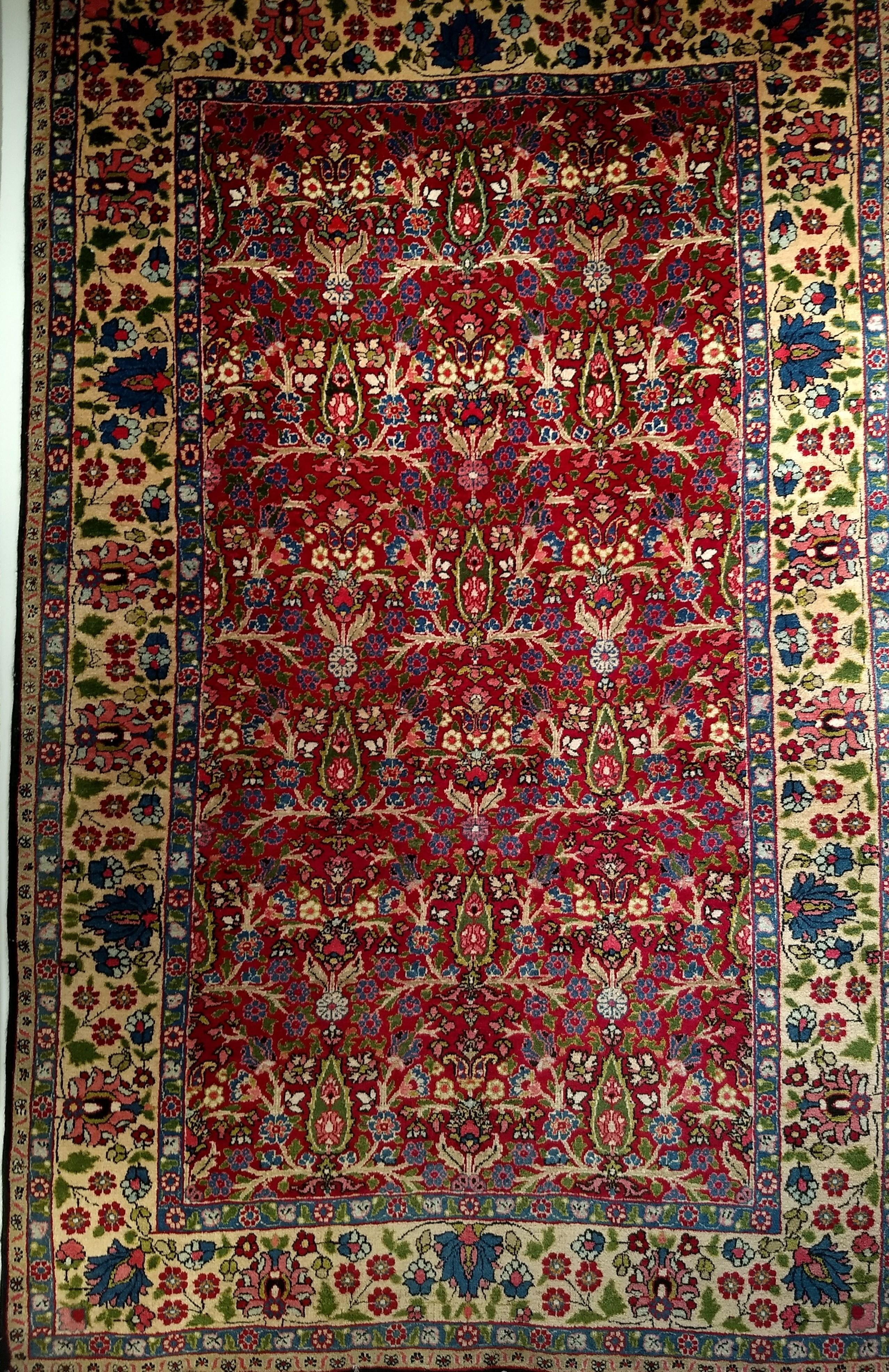 Vintage Persian Tabriz area rug in an allover cypress trees floral pattern from the 2nd quarter of the 1900s.  The rug design has the cypress tree in a repeated format.  The cypress tree is considered a symbol of life in Persian culture.  The trees
