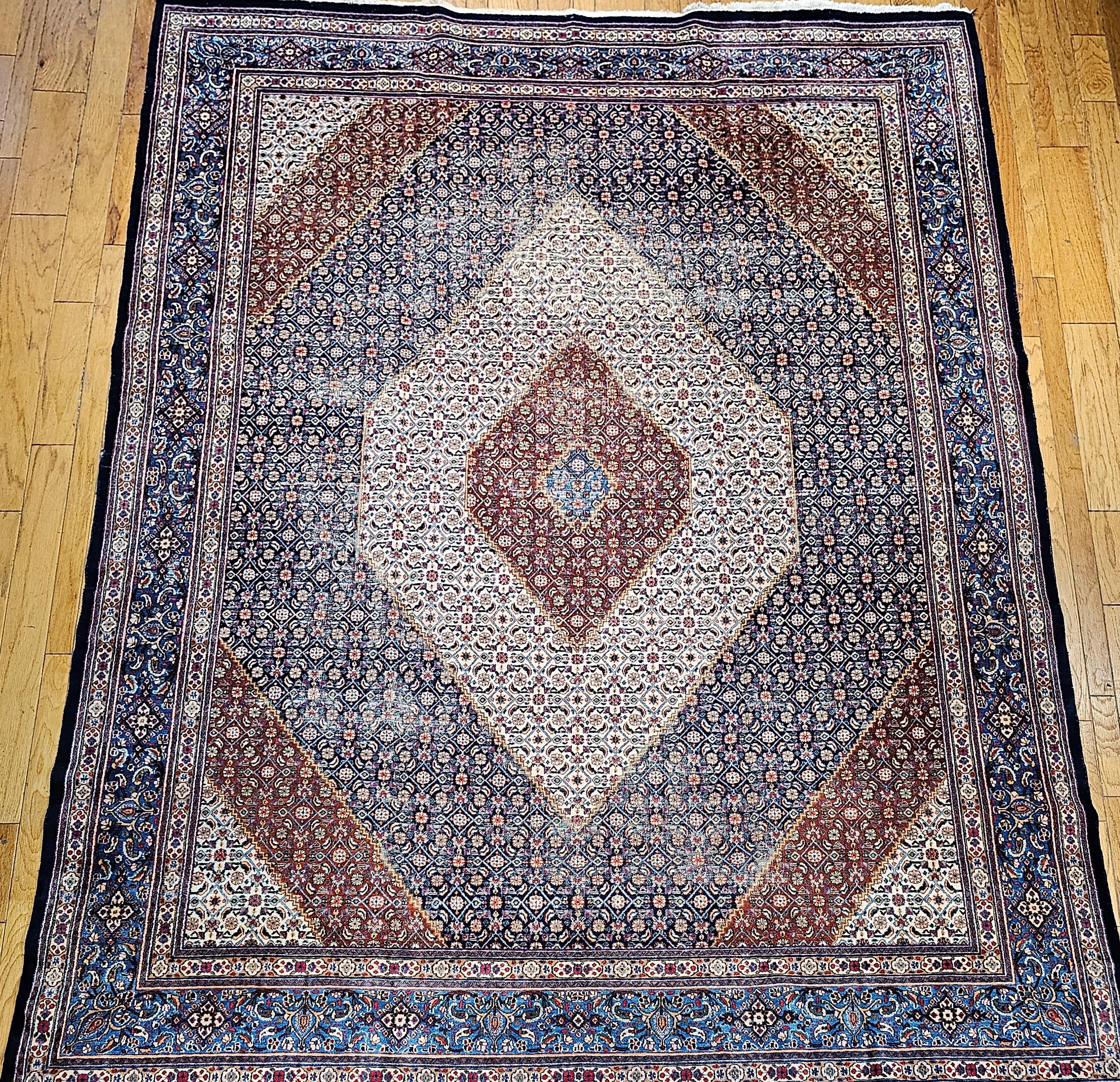 This Persian Tabriz Mahi was woven by an artisan workshop in the city of Tabriz in NW Persia.  This vintage Tabriz Mahi has a Herati design throughout the field and comes in a very unique color combination. The primary field color is navy blue with