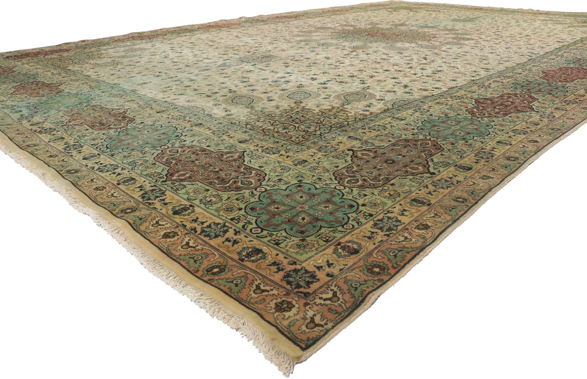77744 vintage Persian Tabriz Palace rug 12'06 x 19'01. Inspired from The Ardabil Carpet from the Safavid Dynasty, this hand-knotted wool vintage Persian Tabriz area rug features a beige circular 16-point center medallion flanked by a ring of sixteen
