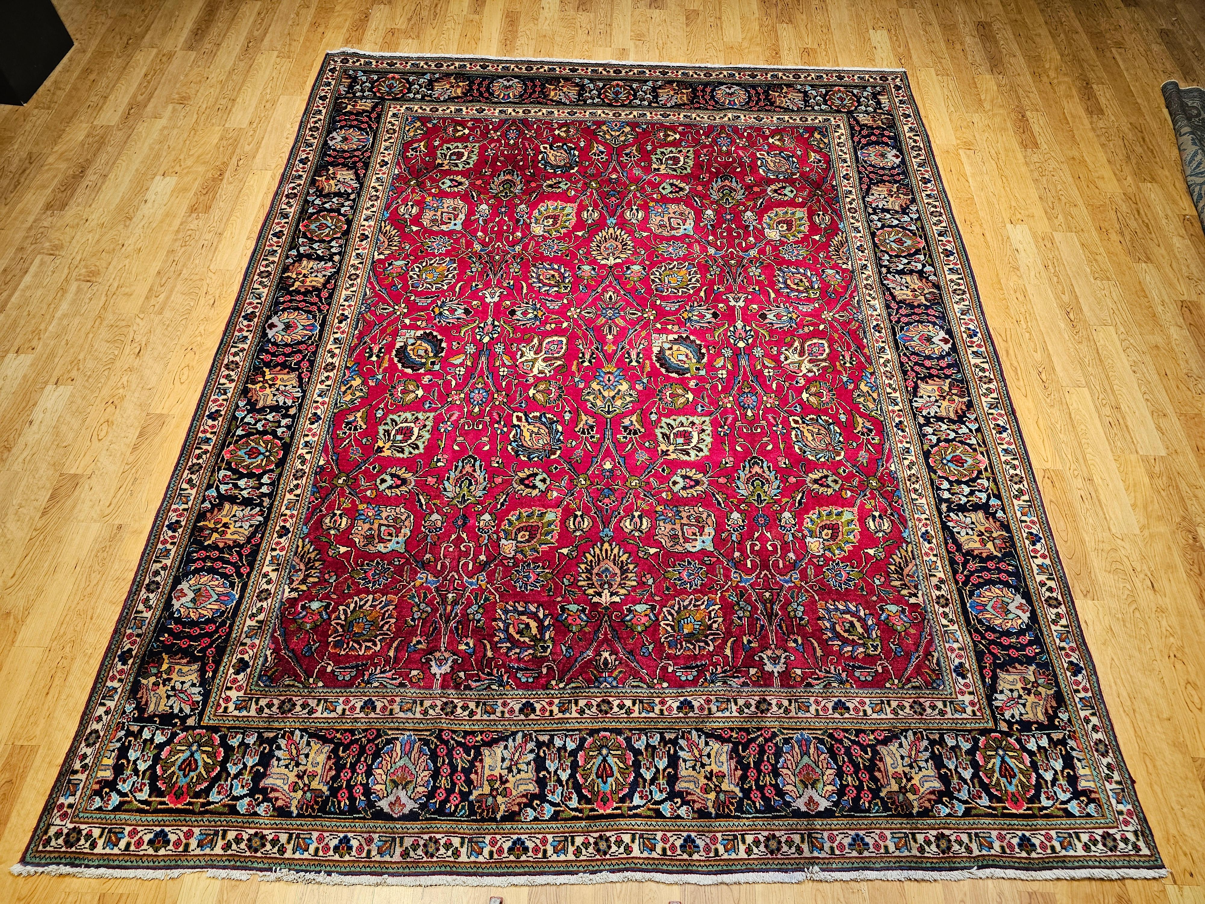 Bring cheerful elegance to your home with this magnificent Vintage Persian Tabriz room size rug, hand-knotted circa the mid-1900s. From the celebrated weaving city of Tabriz, this piece is a testament to timeless artistry.
This exceptionally