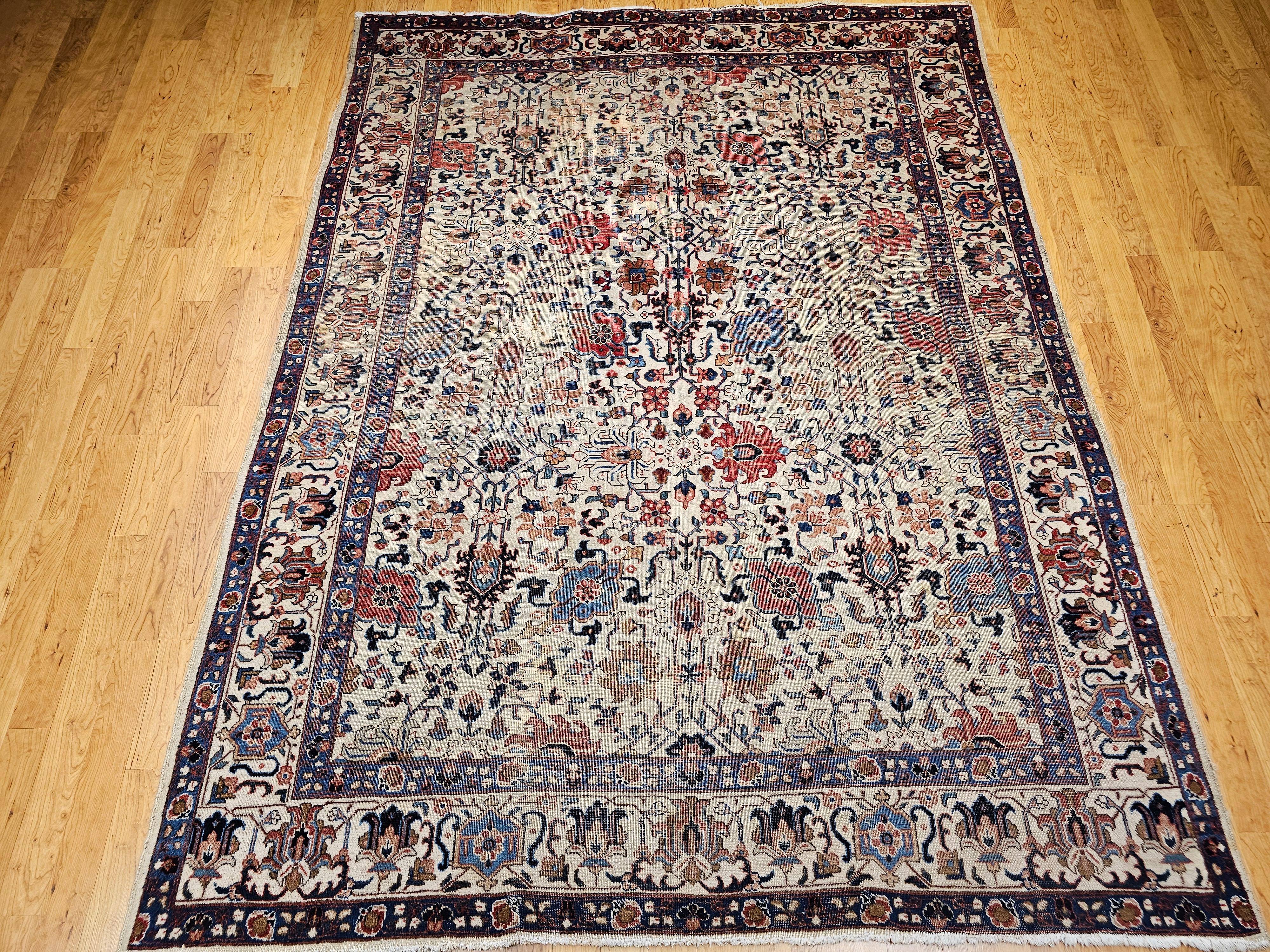 This exquisite vintage Persian Tabriz room-size rug, woven circa the mid-1900s, features a vibrant all over geometric floral pattern that brings both sophistication and charm to any interior. Hand-knotted with a wool pile on a durable cotton