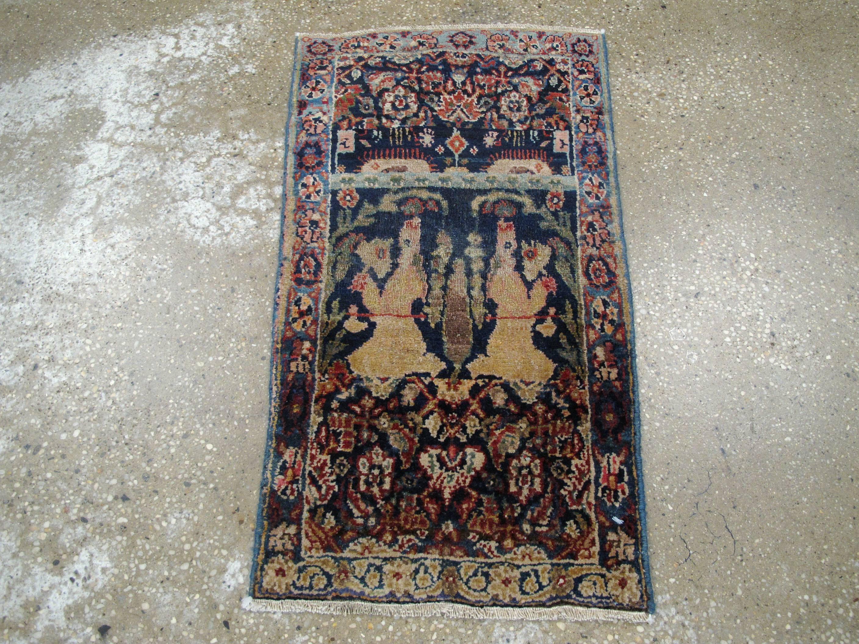A vintage Persian pictorial Tabriz rug from the mid-20th century.