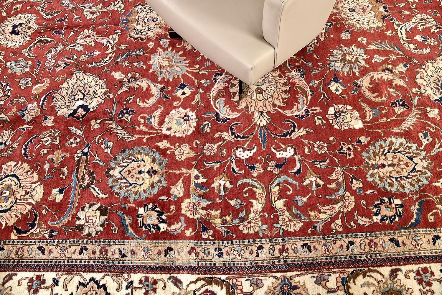 This luxurious Tabriz revival is nothing shy of elegance and artistry. A traditional creation encompasses the beauty and sophistication of traditional Persian designs in cream and bright red. This rug is suitable for both traditional and modern