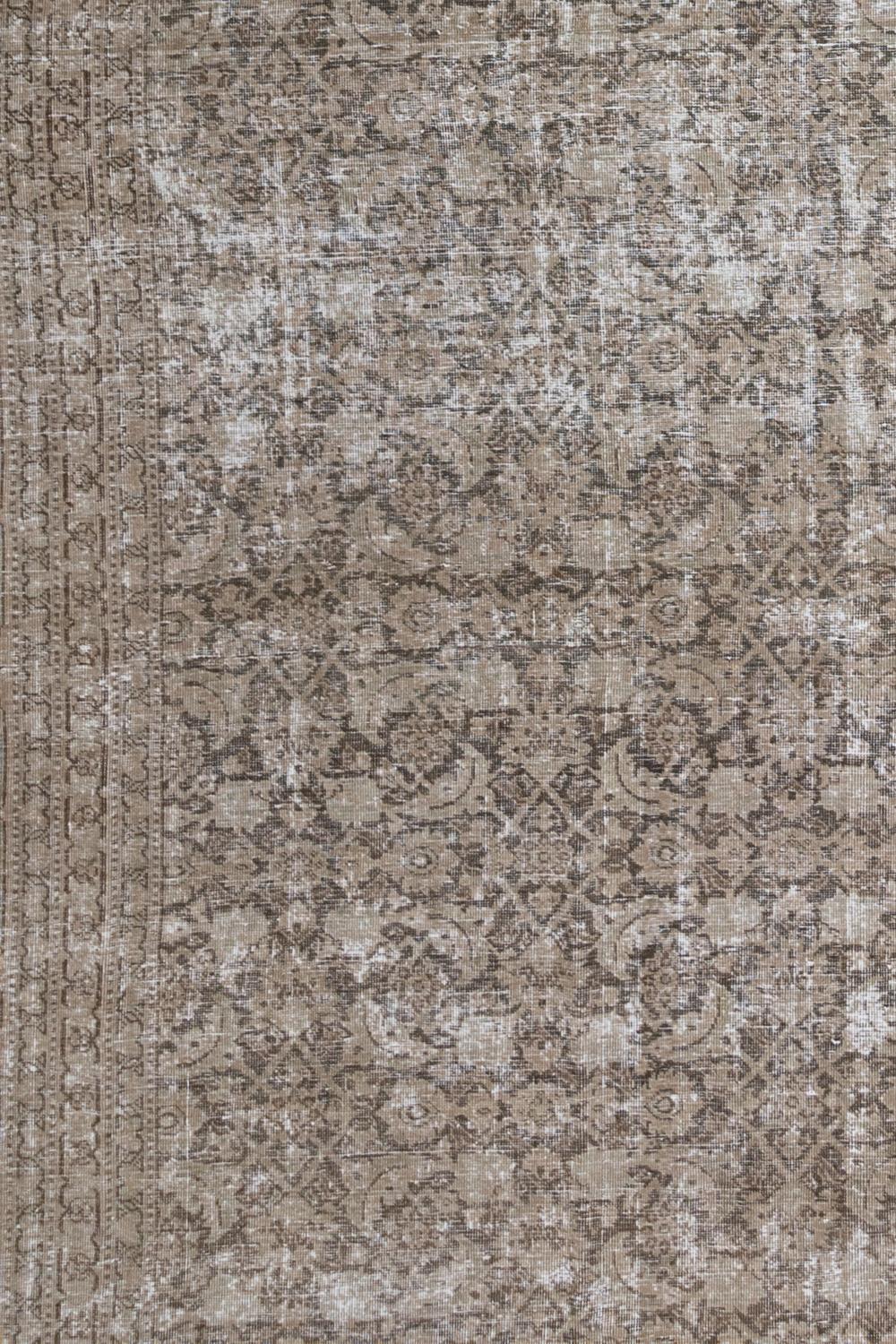 Age: 1920

Pile: Low

16800

Material: Wool on Cotton

Classic vintage Persian Tabriz with an all over herati pattern. Portobello toned field with a gray design that is a designer's dream for styling. Safe for high traffic with a heavy feel.