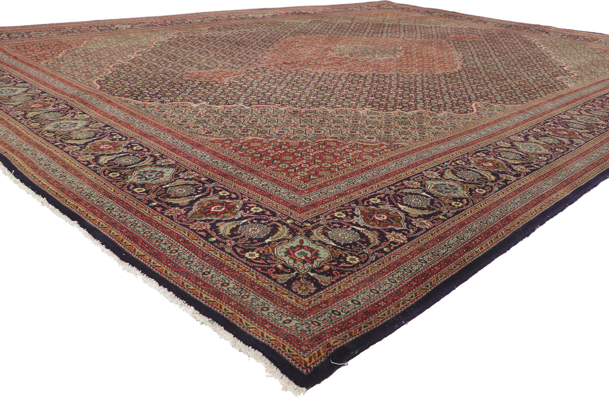 60998 vintage Persian Tabriz rug, 09'10 x 13'01.
?With its decorative detailing and well-balanced symmetry, this hand knotted wool vintage Persian Tabriz rug is a captivating vision of woven beauty. The renowned Fish-Mahi design and sophisticated