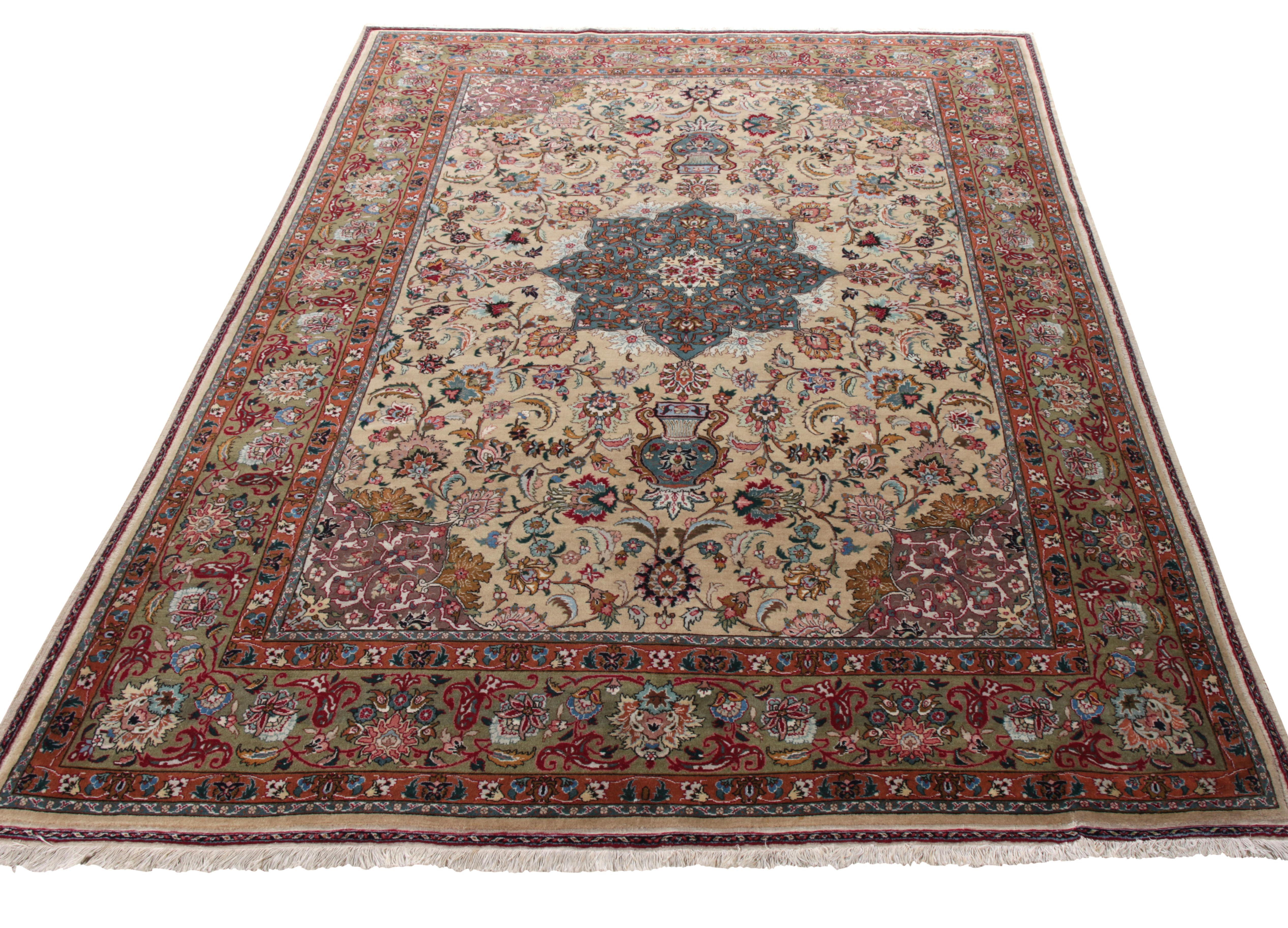 Originating from Persia circa 1950-1960, this hand-knotted vintage Tabriz rug makes a splendid entry to Rug & Kilim’s Antique & Vintage collection. The medallion pattern in royal blue immediately catches the eye and leads the focus towards the