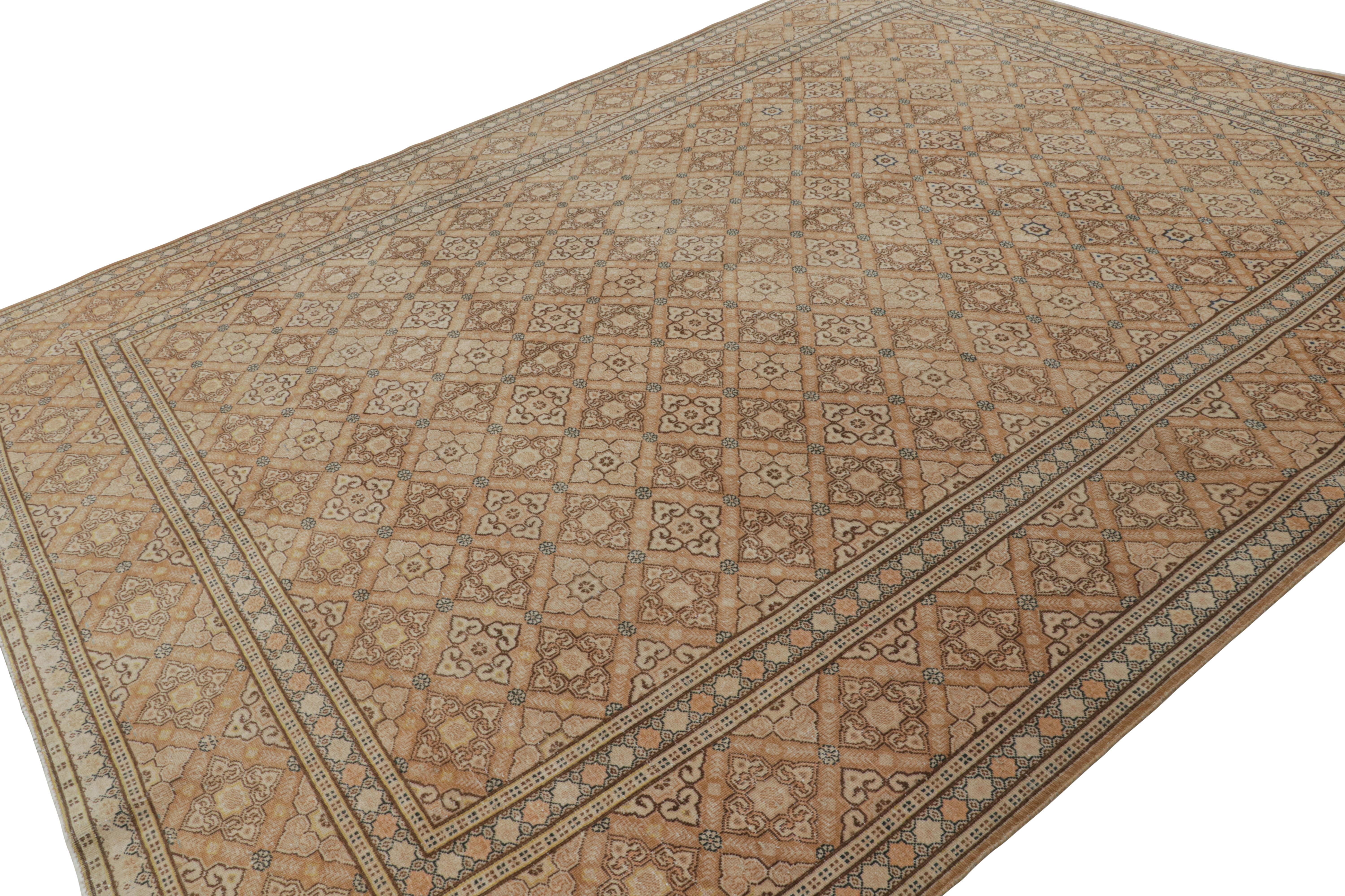 Hand-knotted in luxurious wool, this 9x13 vintage Persian Tabriz rug features a rich design of repetitive floral patterns in hues of terracotta, beige/brown and blue. 

On the design:

Connoisseurs will admire the sense of dimension in the subtle