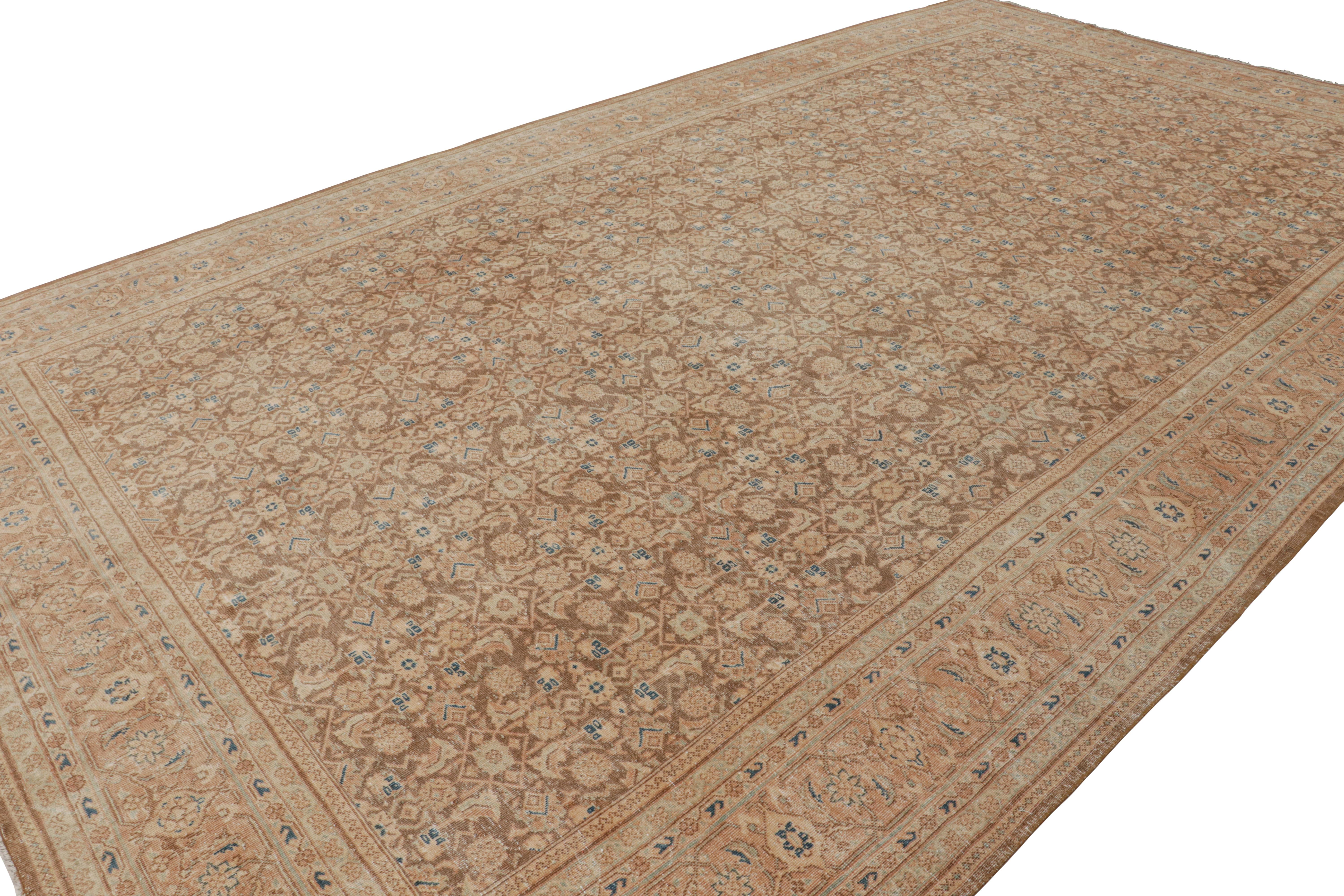 Hand-knotted in luxurious wool, this 10x16 vintage Persian Tabriz rug is a rich example of the Herati pattern. The design features a chocolate brown field with pink and blue and some terracotta tones. 

On the Design: 

Keen eyes for detail will