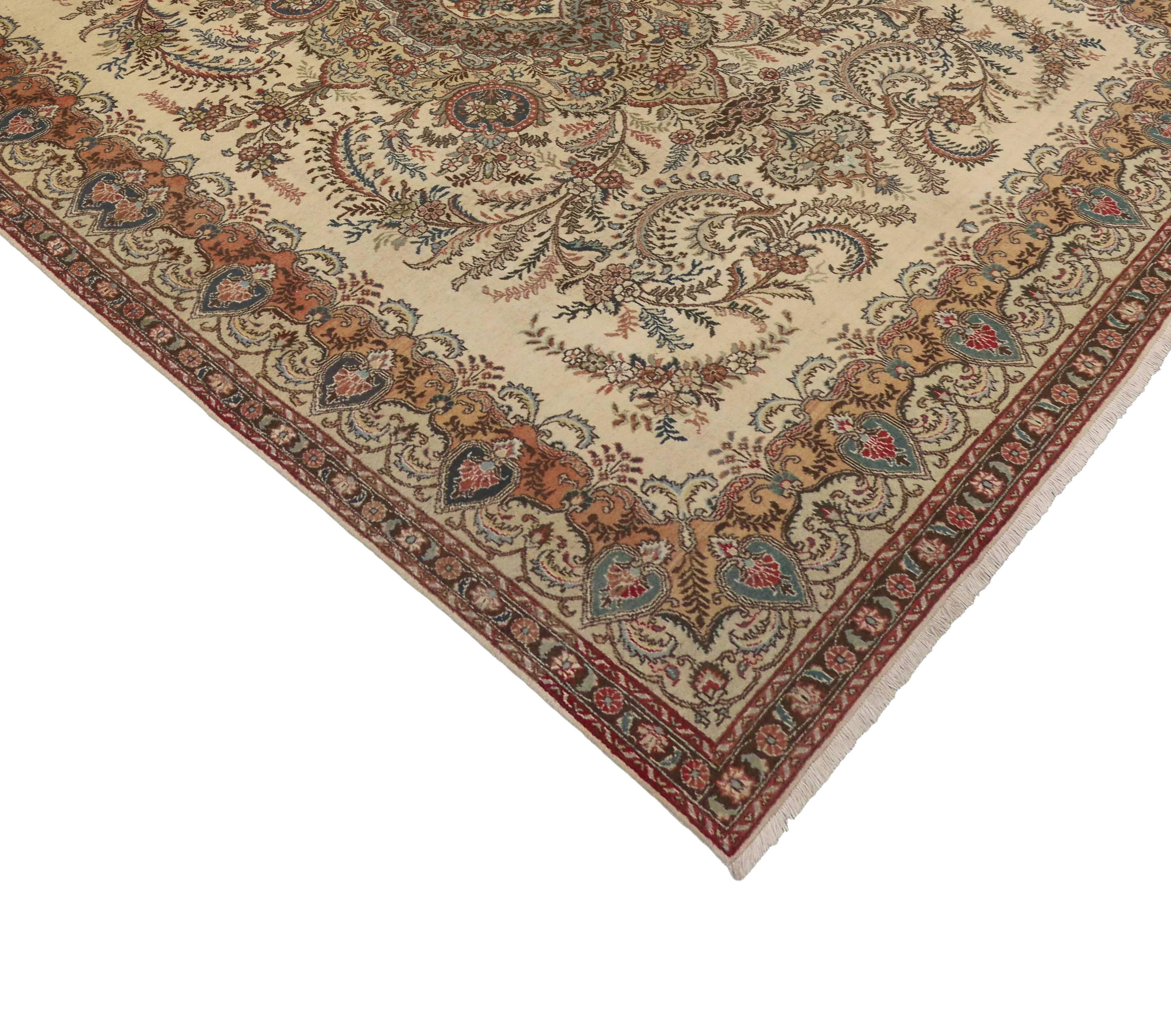 76285 vintage Persian Tabriz rug in light colors. Absolutely magnificent with traditional style and light colors, this vintage Persian Tabriz rug is characterized by an impeccable level of detail. This Persian Tabriz rug features an ornate centre