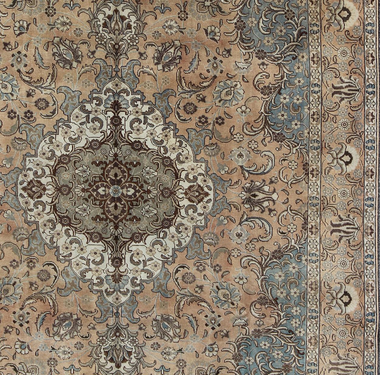 Tabriz Antique rug from Persia with all-over Floral Geometric design in earth tones, rug H-703-04, country of origin / type: Iran / Tabriz, circa 1950

This Persian Tabriz carpet (circa mid-20th century) features a refined palate of mocha, camel,