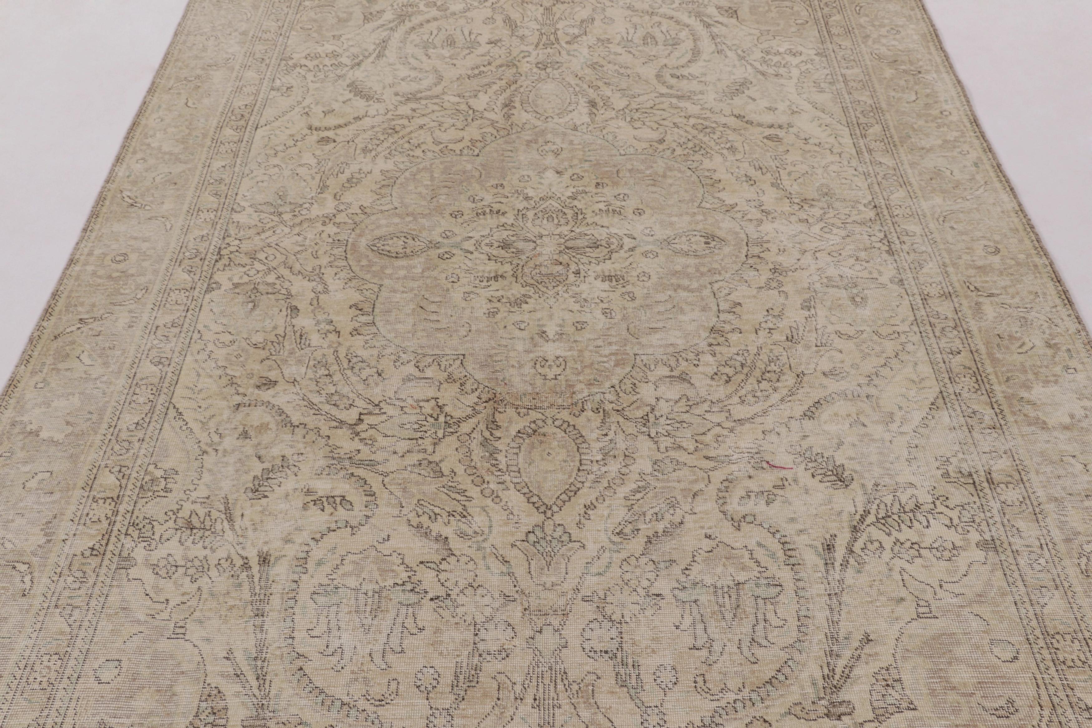  Made with hand-knotted wool and originating circa 1970-1980, this 6x9 vintage Persian Tabriz rug represents a truly distinguished addition to Rug 
Kilim's vintage collection—an exemplar of the legendary Tabriz weaving tradition. It features a