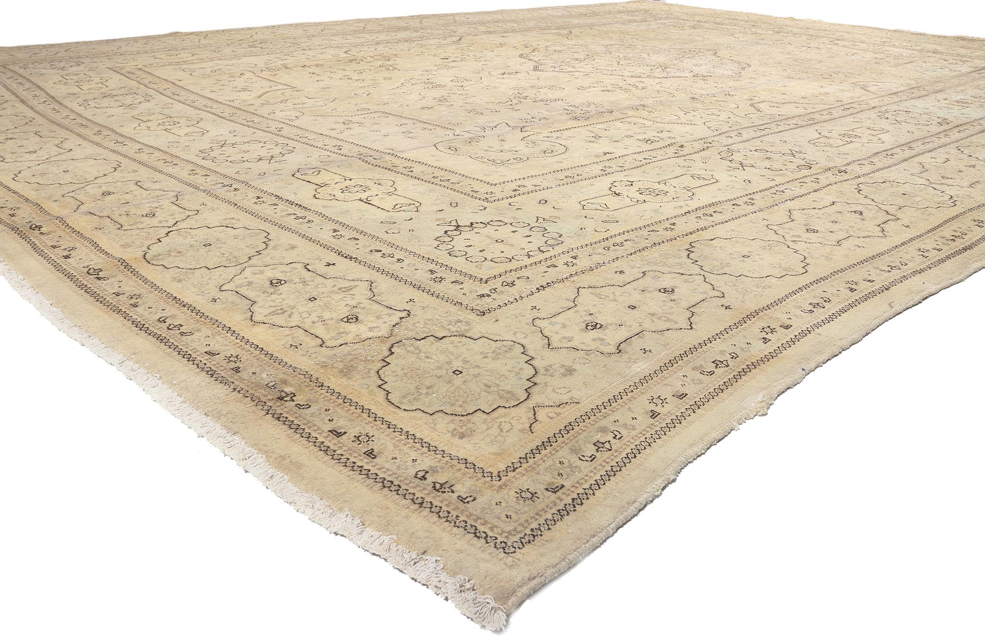 78595 Vintage Persian Tabriz Rug, 13'09 x 18'10. 
Emulating relaxed elegance with incredible detail and texture, this hand knotted vintage Persian Tabriz rug is a captivating vision of woven beauty. The faded floral design and soft colors woven into