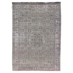 Tappeto persiano vintage Tabriz con medaglione floreale nei toni della terra e del marrone