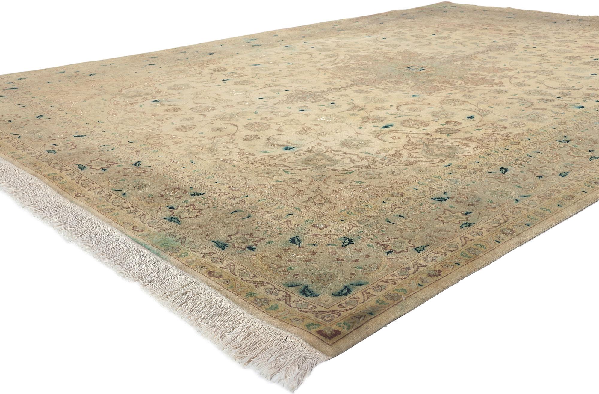 76976 Vintage Persian Tabriz Rug, 06'08 x 10'00. 
Refined elegance meets soft, bespoke Bridgerton style in this hand knotted wool and silk Persian Tabriz rug. The elaborate botanical details and soft pastel colorway woven into this piece work