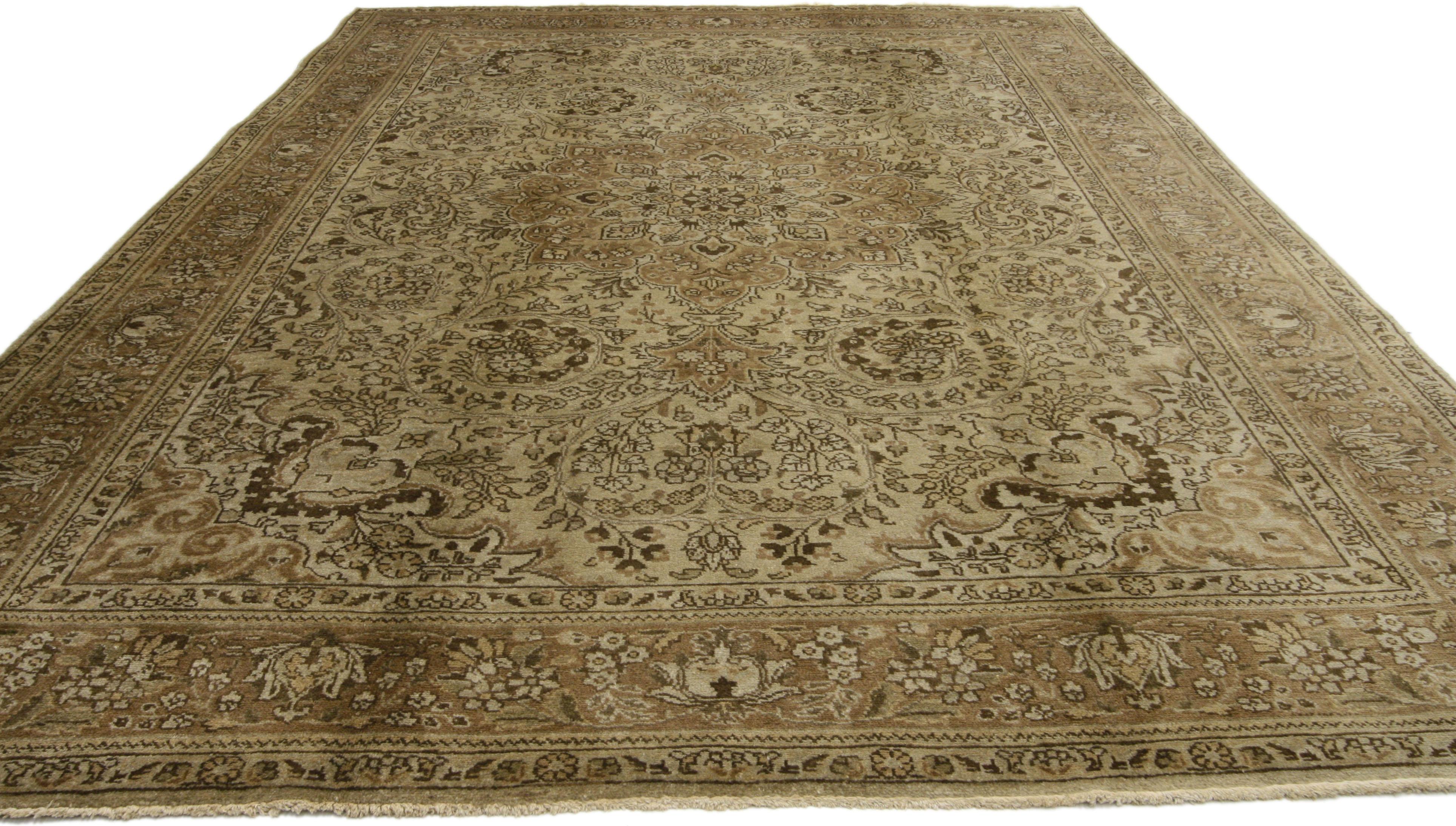 75972, vintage Persian Tabriz rug with neutral colors. Emanating grace and timeless style, this Vintage Persian Tabriz Rug features a captivating design composition in a range of neutral hues to a dazzling effect. A round floral medallion with