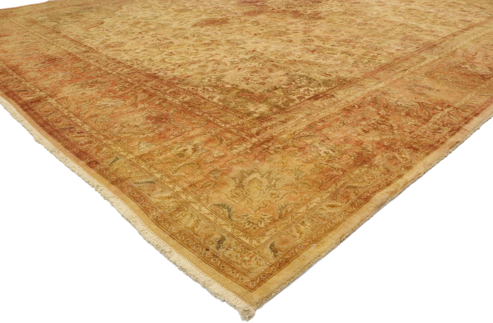 76376 Vintage Persian Tabriz Rug, 09'08 x 12'07. Radiating timeless elegance and a comforting array of earthy hues, this hand-knotted wool vintage Persian Tabriz rug exudes the rustic charm of an Italian Tuscan villa. The abrashed field, reminiscent