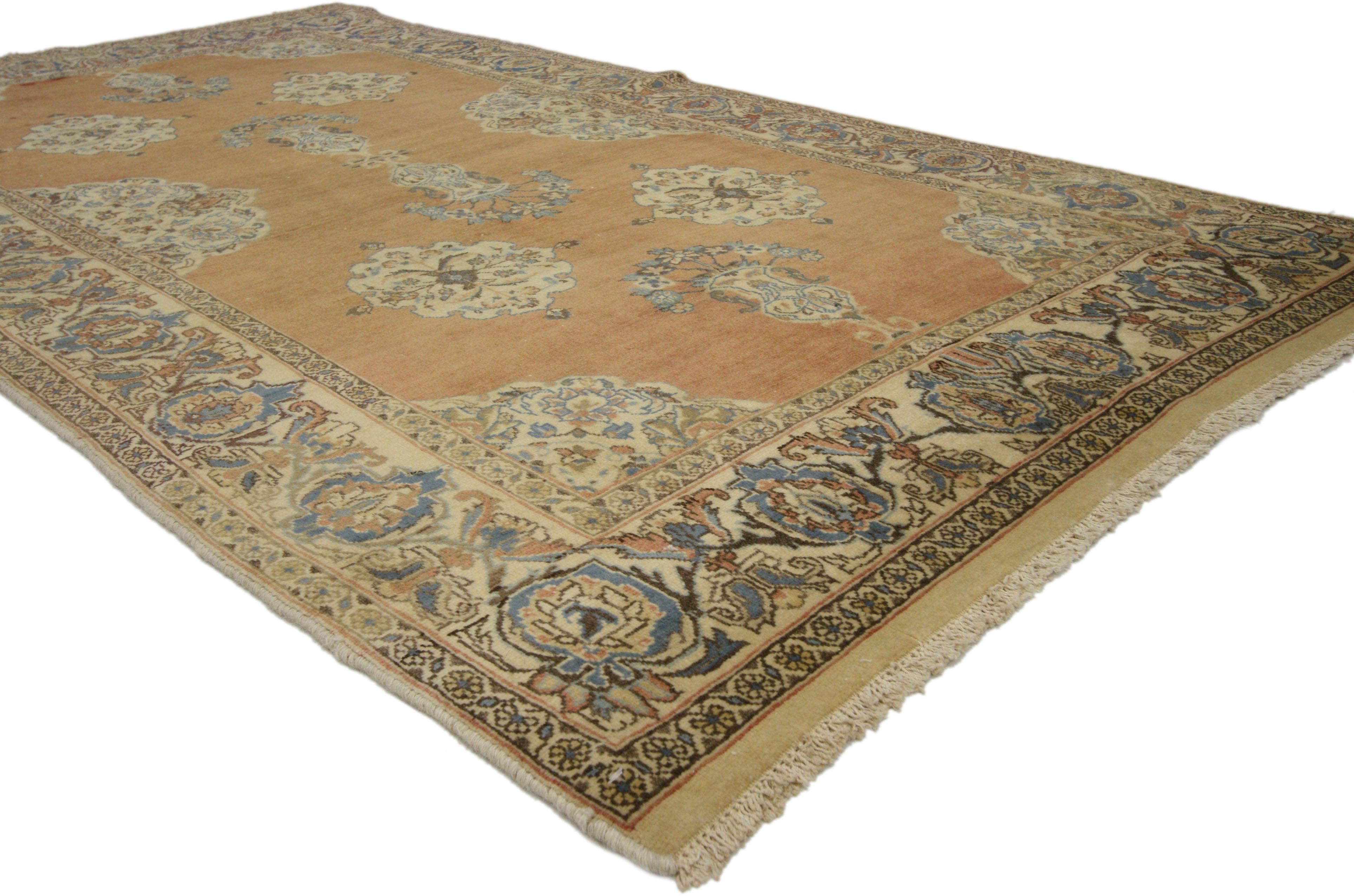 75204 Vintage Persian Tabriz rug with Swedish Farmhouse Style 04'00 X 07'07. This hand-knotted wool vintage Tabriz rug features beautiful vase motifs along the center of an abrashed field surrounded by four scalloped floral medallions. Elaborate