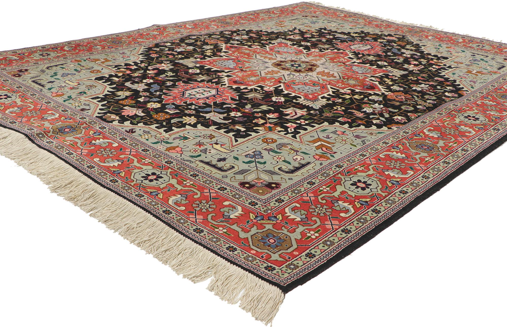74651 Vintage Persian Tabriz Rug, 05’01 x 06’08. 
This striking rug features a star shaped central medallion with a geometric floral motif in steel, salmon, lavender and sage on a contrasting field of midnight corned by slate spandrels and bordered