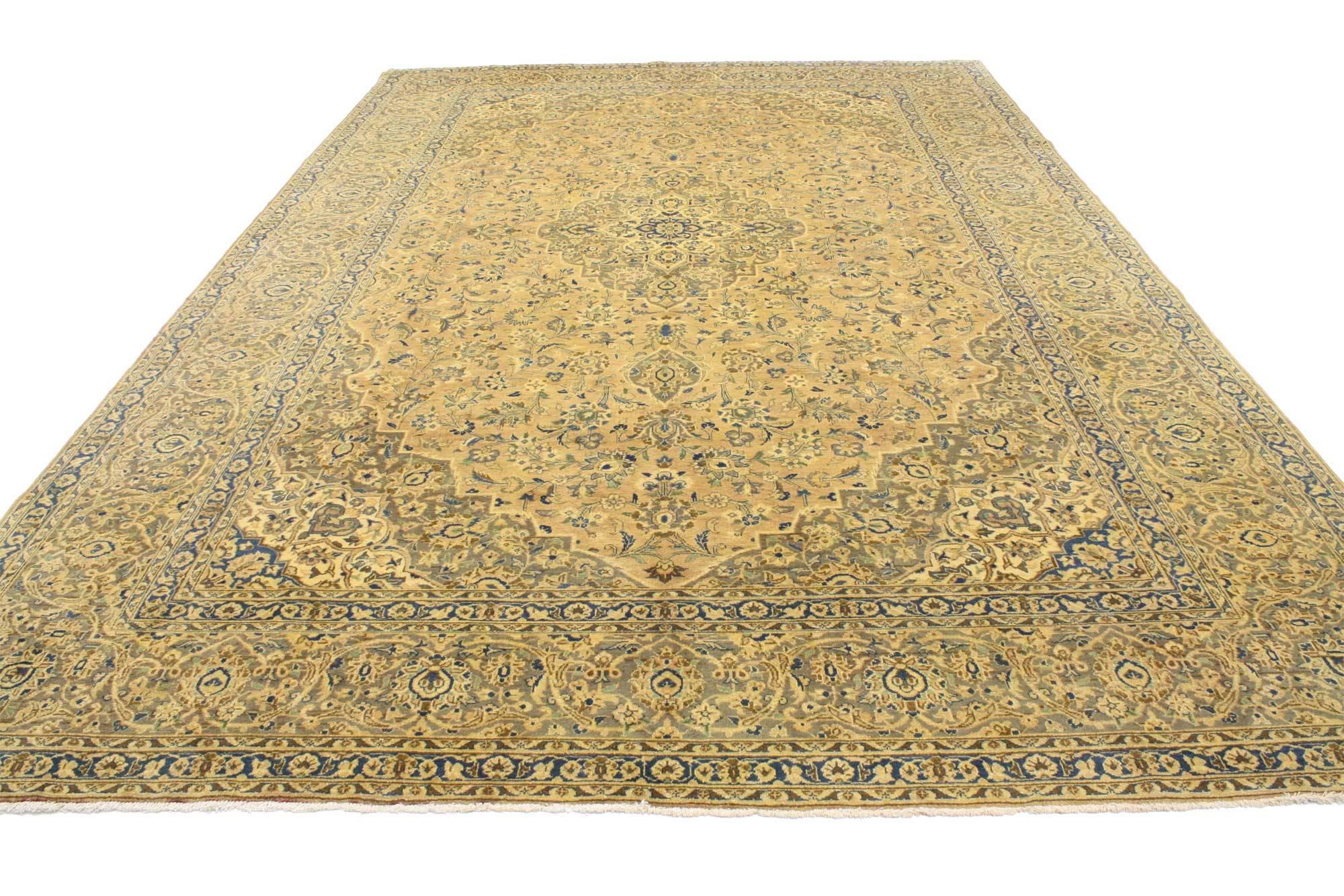 76306, vintage Persian Tabriz rug with traditional style. This hand-knotted wool vintage Persian Tabriz rug features an intricate medallion with an allover pattern surrounded by a classic border creating a well-balanced and timeless design. This