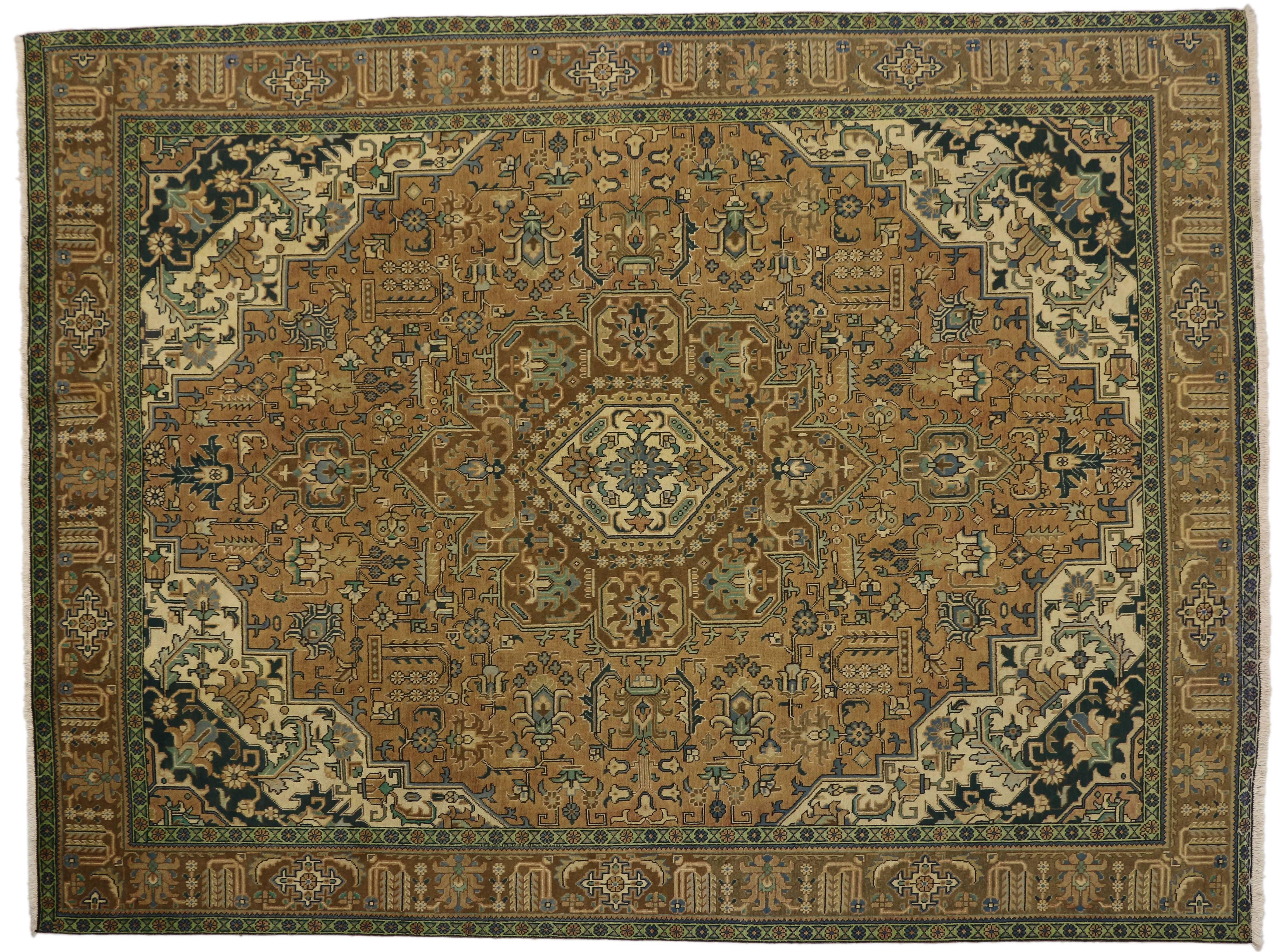 76342, vintage Persian Tabriz rug with traditional style. This hand-knotted wool vintage Persian Tabriz rug features a centre medallion with an all-over pattern surrounded by a classic border creating a well-balanced and timeless design. This
